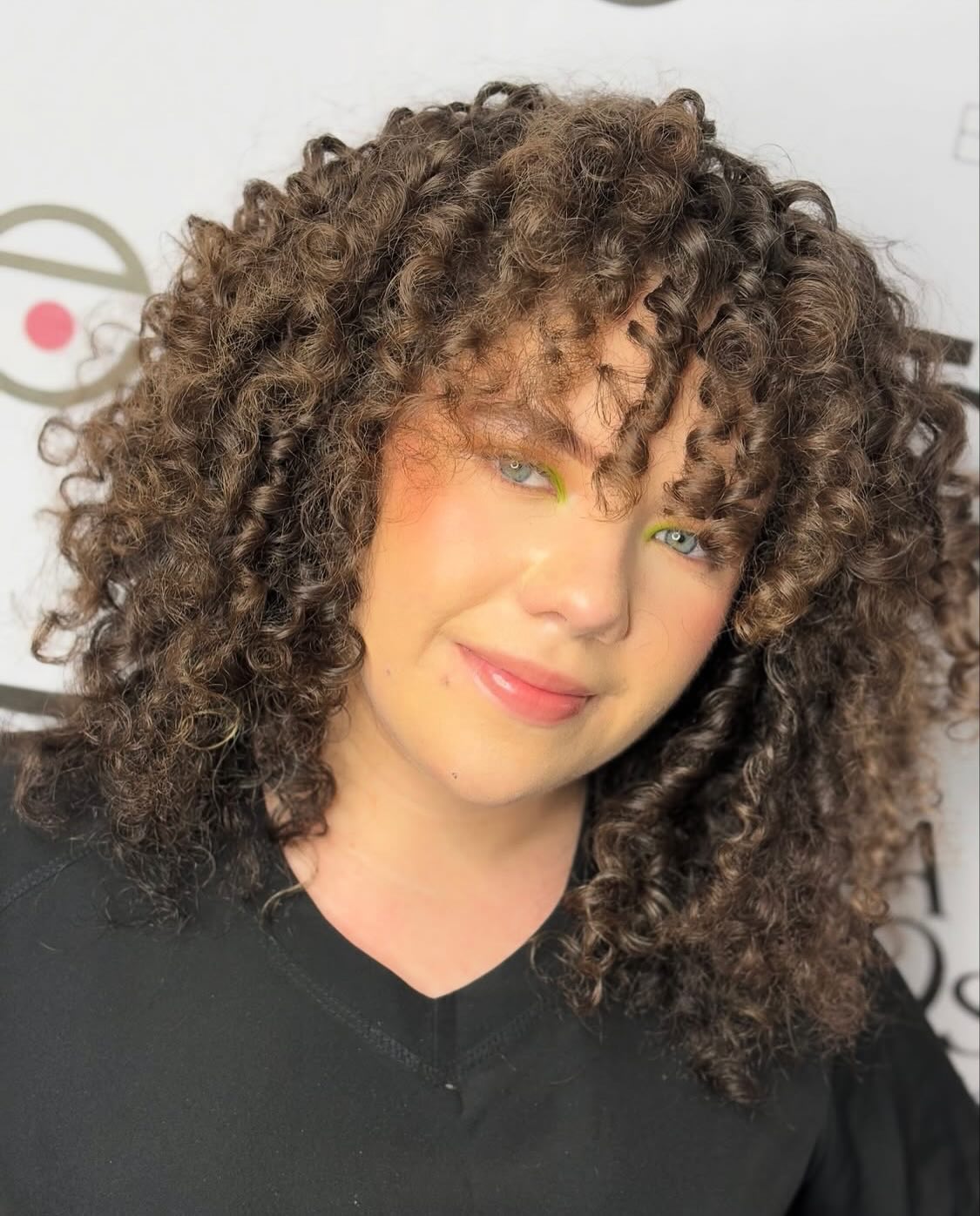 Twirling Chestnut Curls with Voluminous Texture