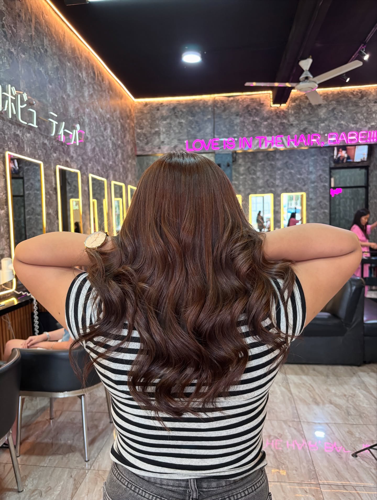 Dynamic Dark Brown Cascading Curls with Subtle Dimension