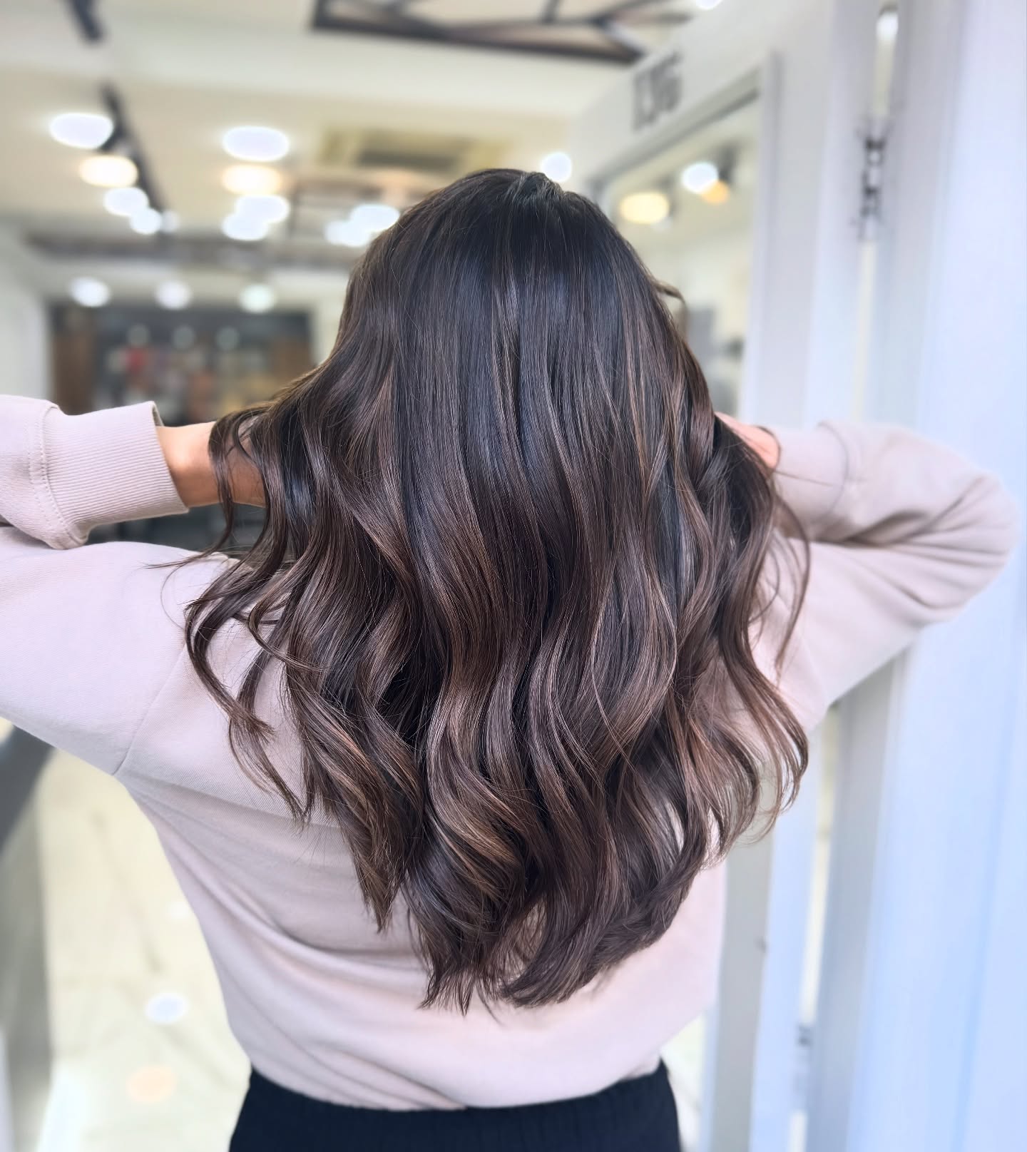 Layered Dark Brown Waves with Caramel Lowlights