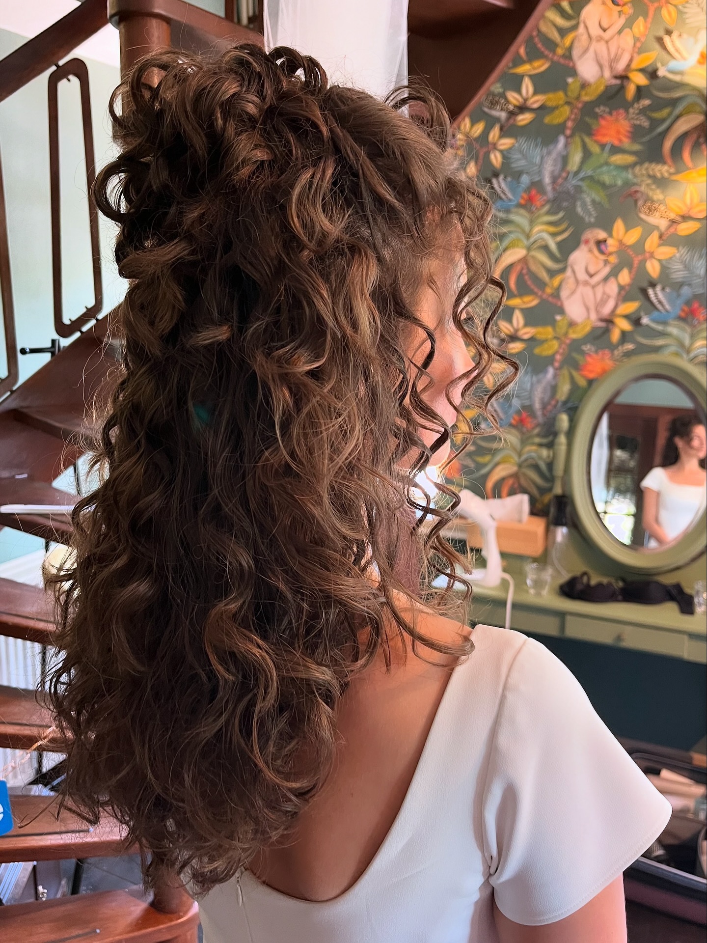 Lush Curly Half-Updo with Cascading Locks