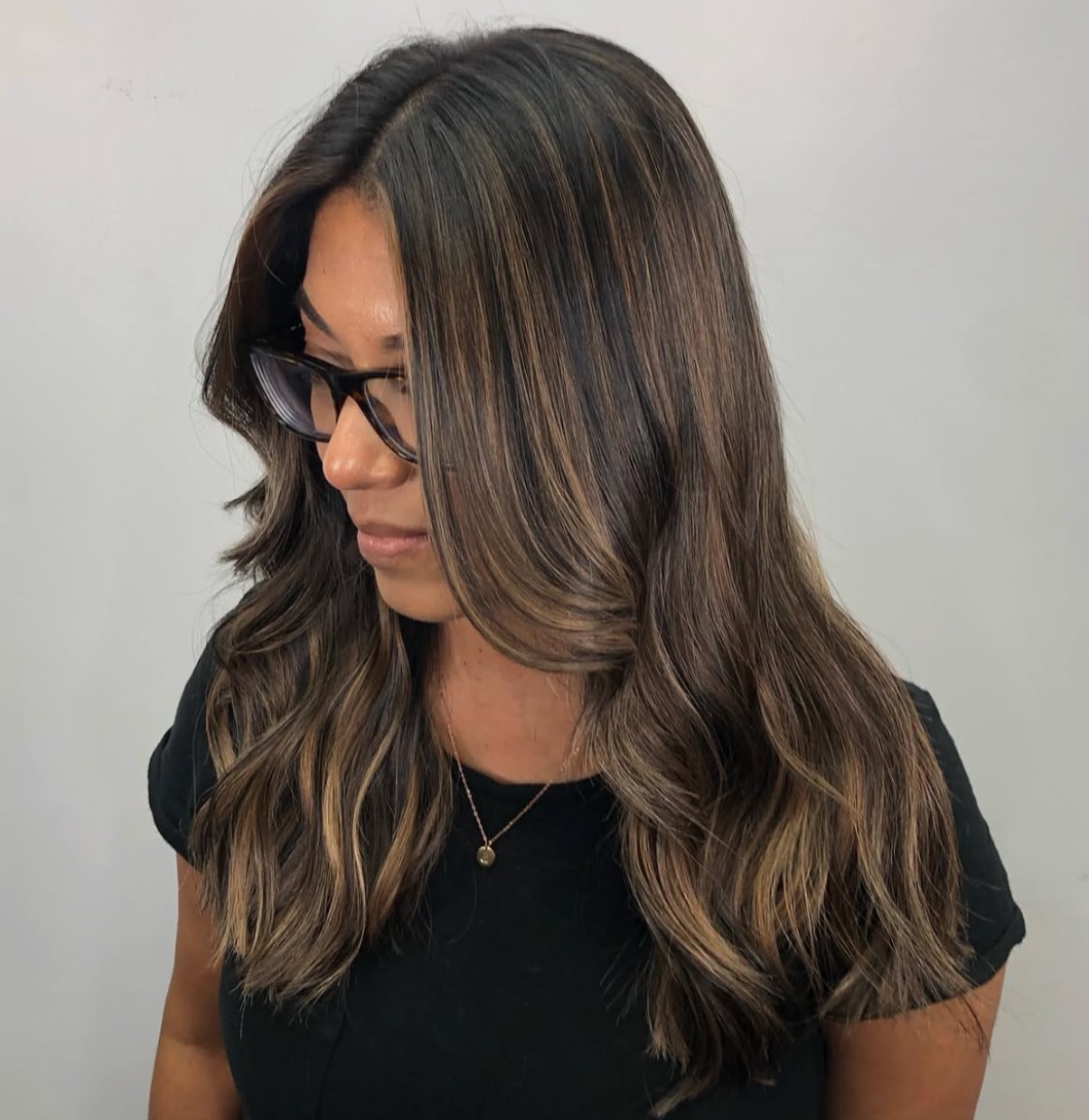 Softly Layered Dark Brown Waves with Warm Highlights