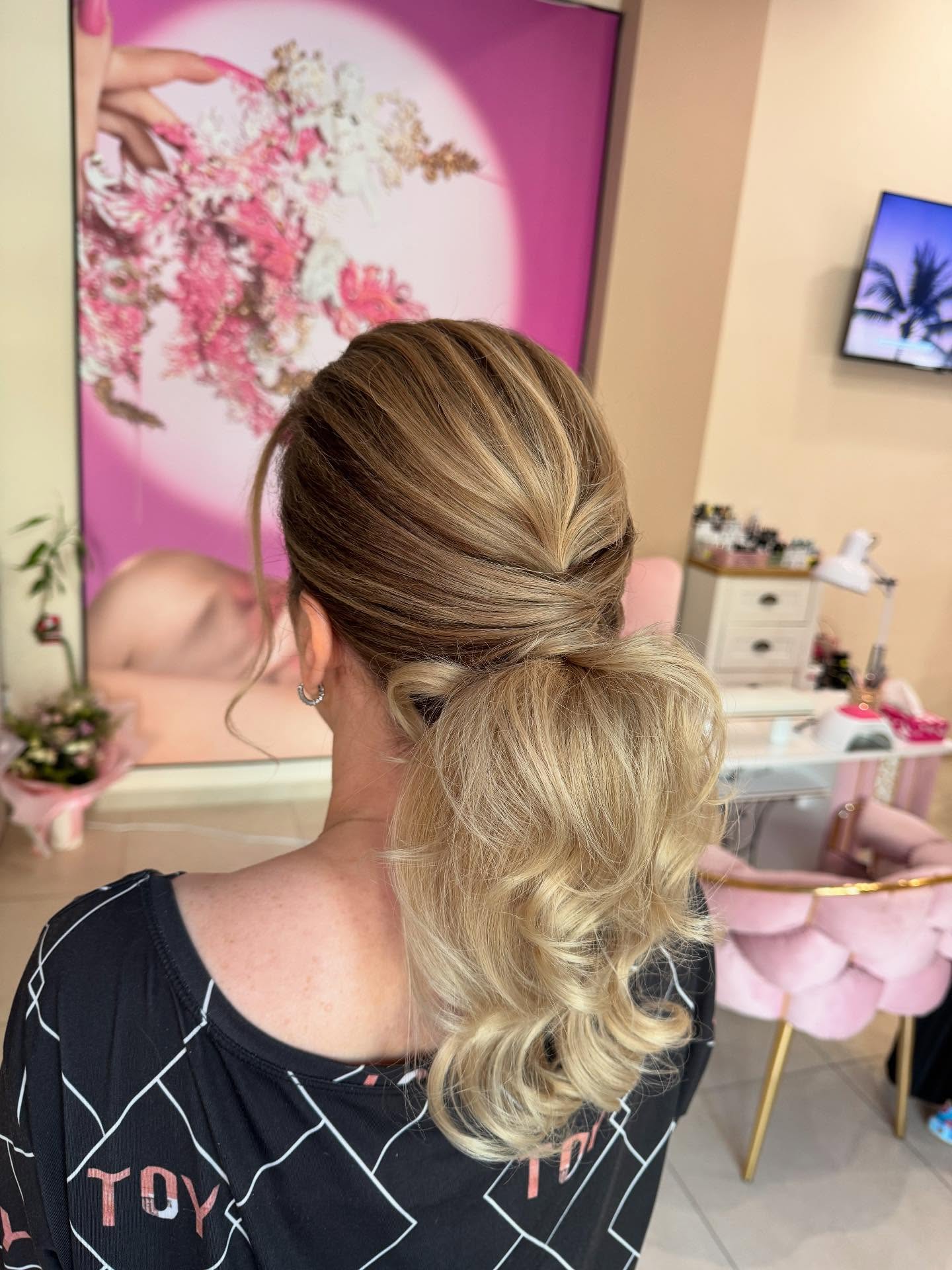 Twisted Blonde Updo with Soft Curls and Tucked Finish