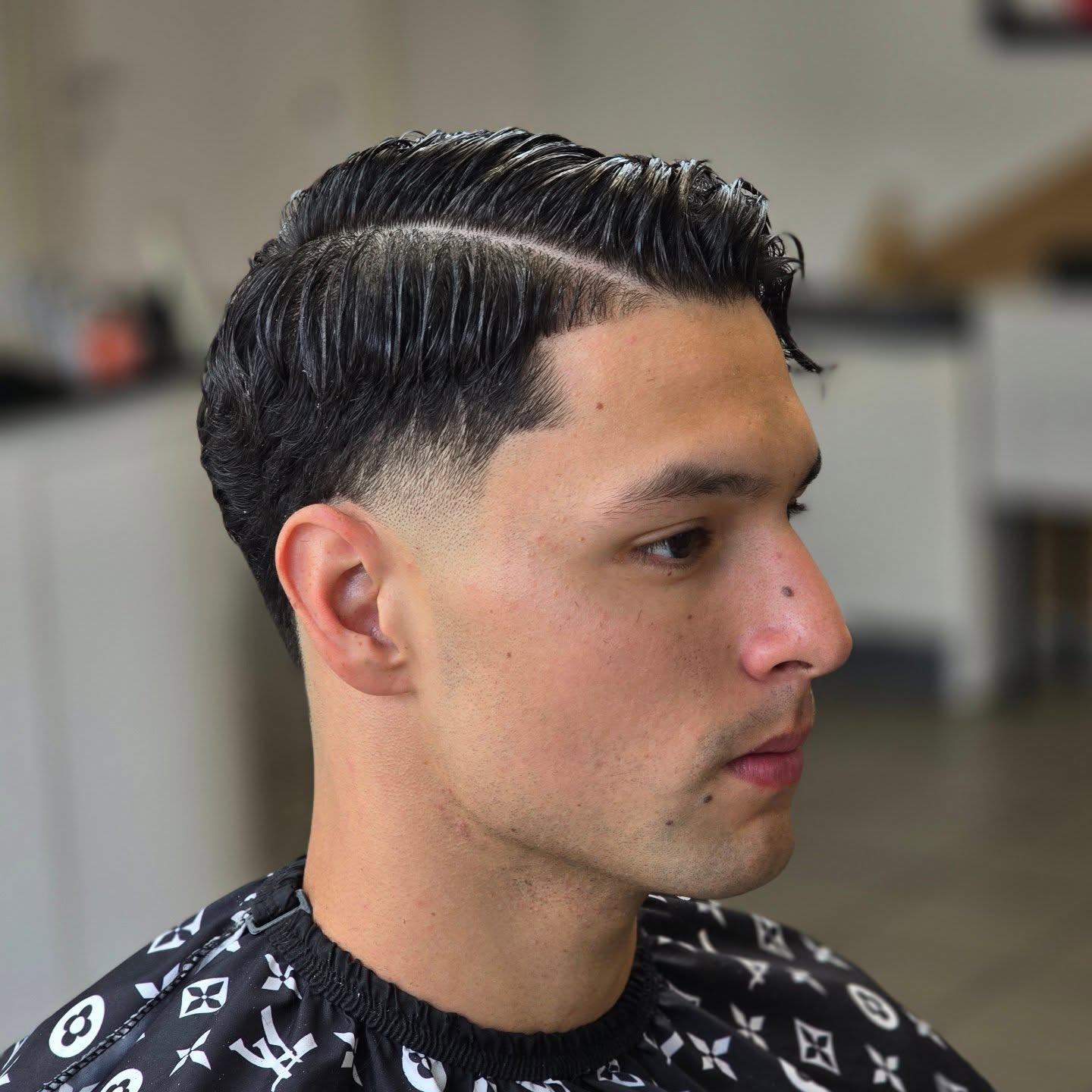 Classic Side Part Mid Taper Fade with Defined Waves