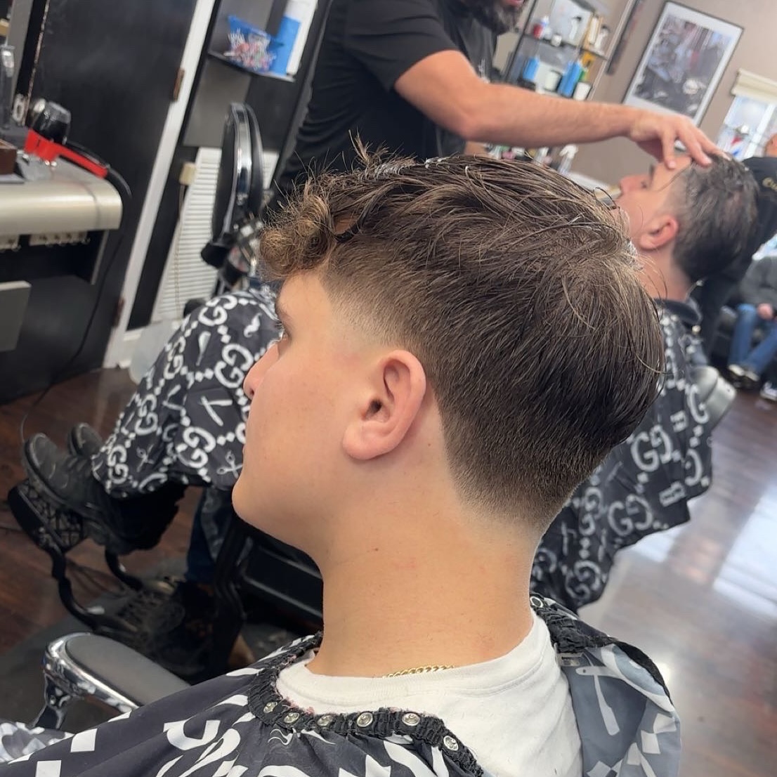 Sleek Curly Mid Taper Fade with Defined Texture