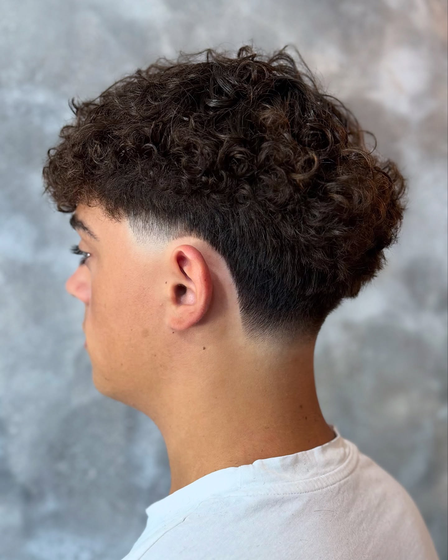 Textured Mid Taper Fade with Defined Curls