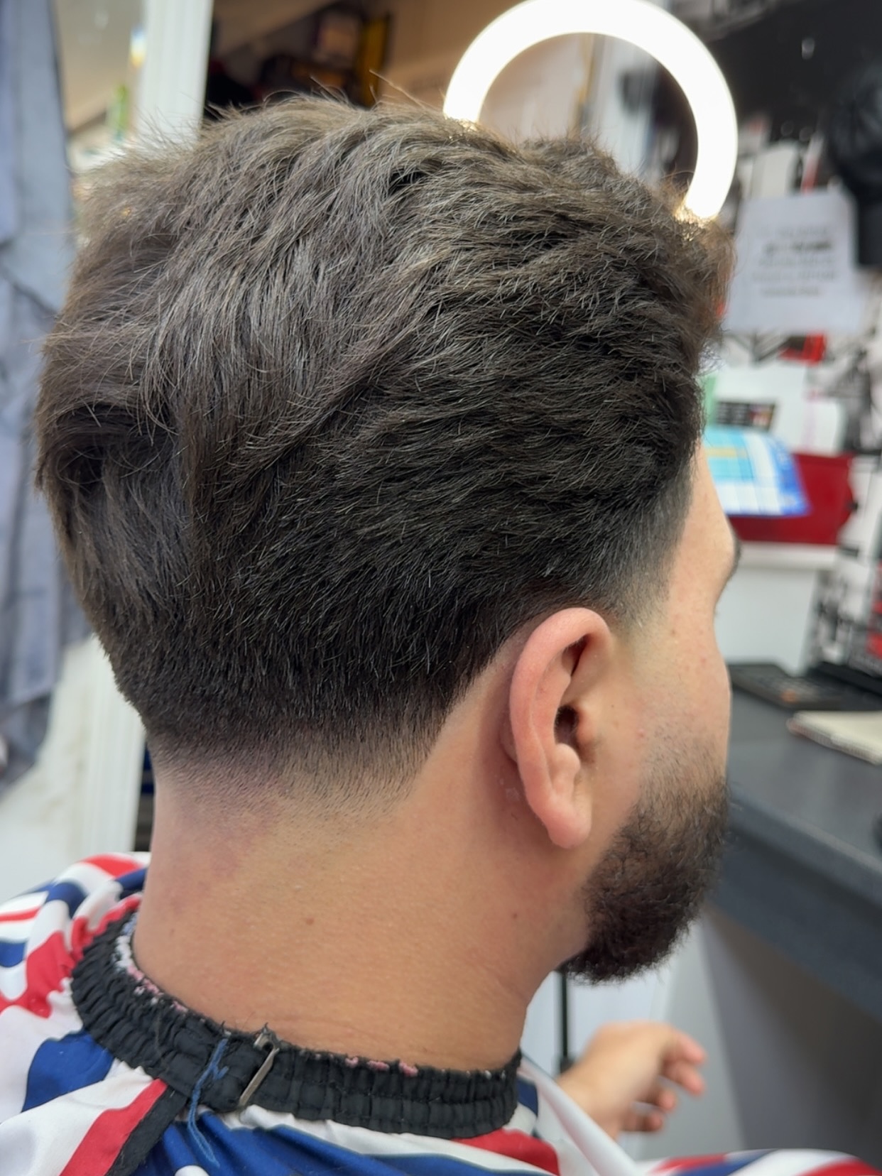 Textured Mid Taper Fade with Defined Volume