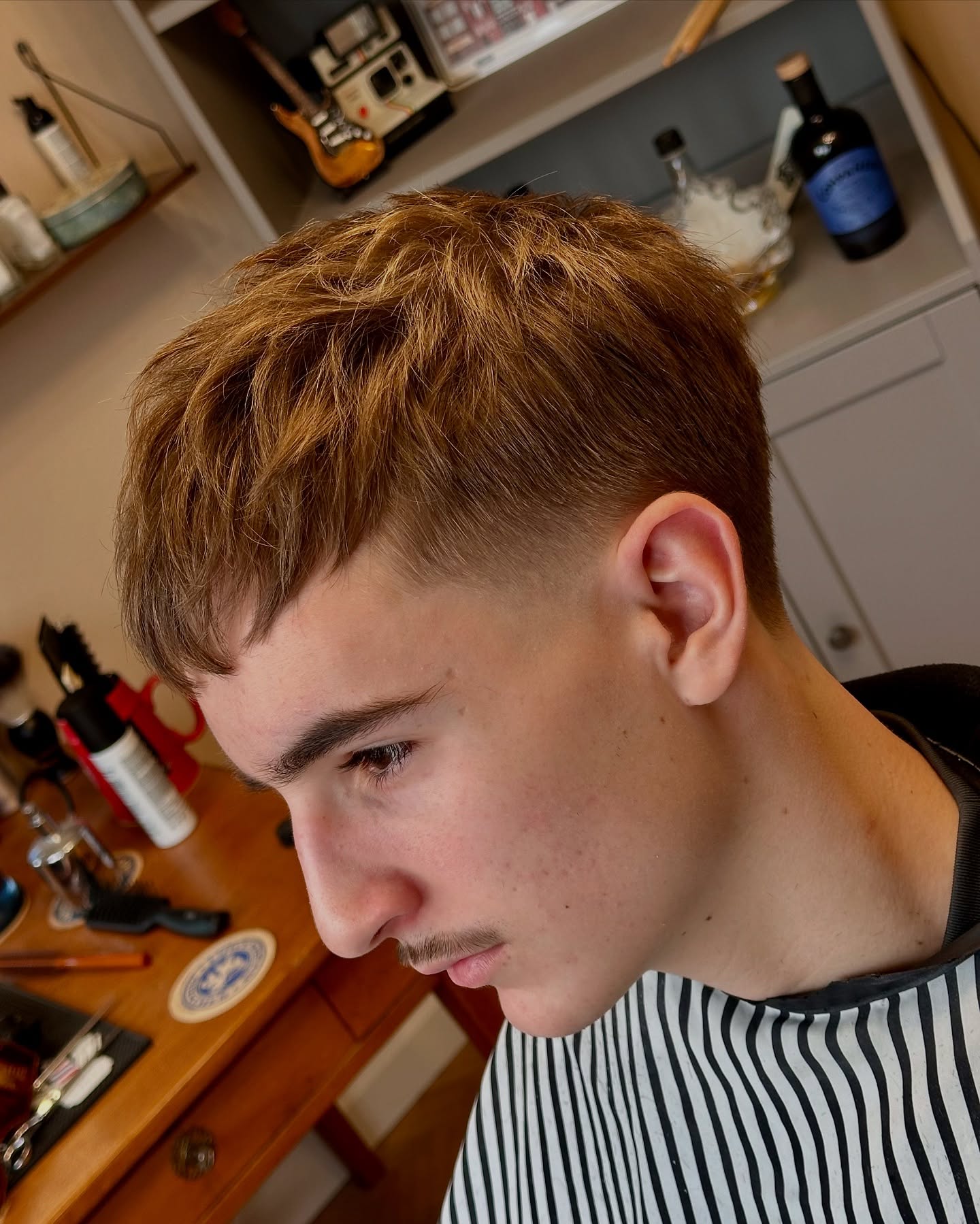 Textured Mid Taper Fade with Subtle Waves