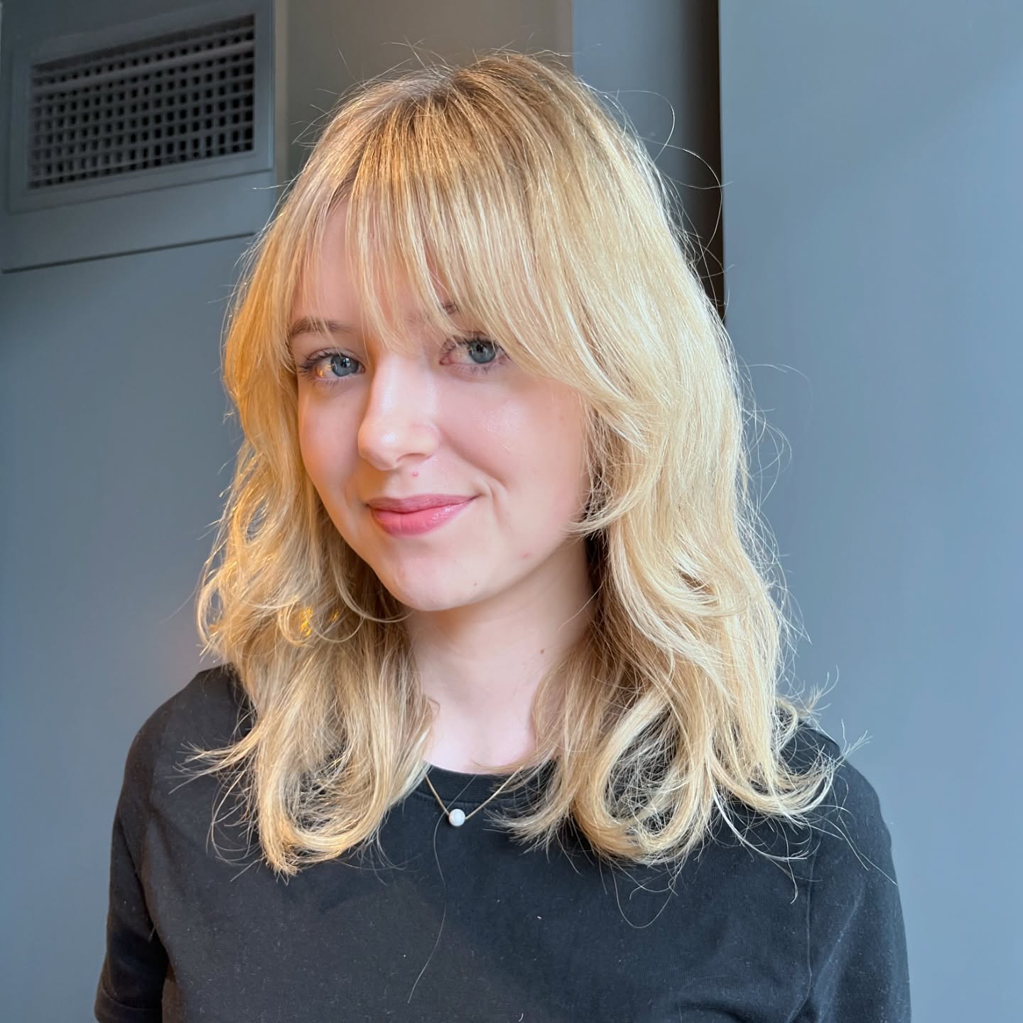 Textured Blonde Waves with Soft Fringe