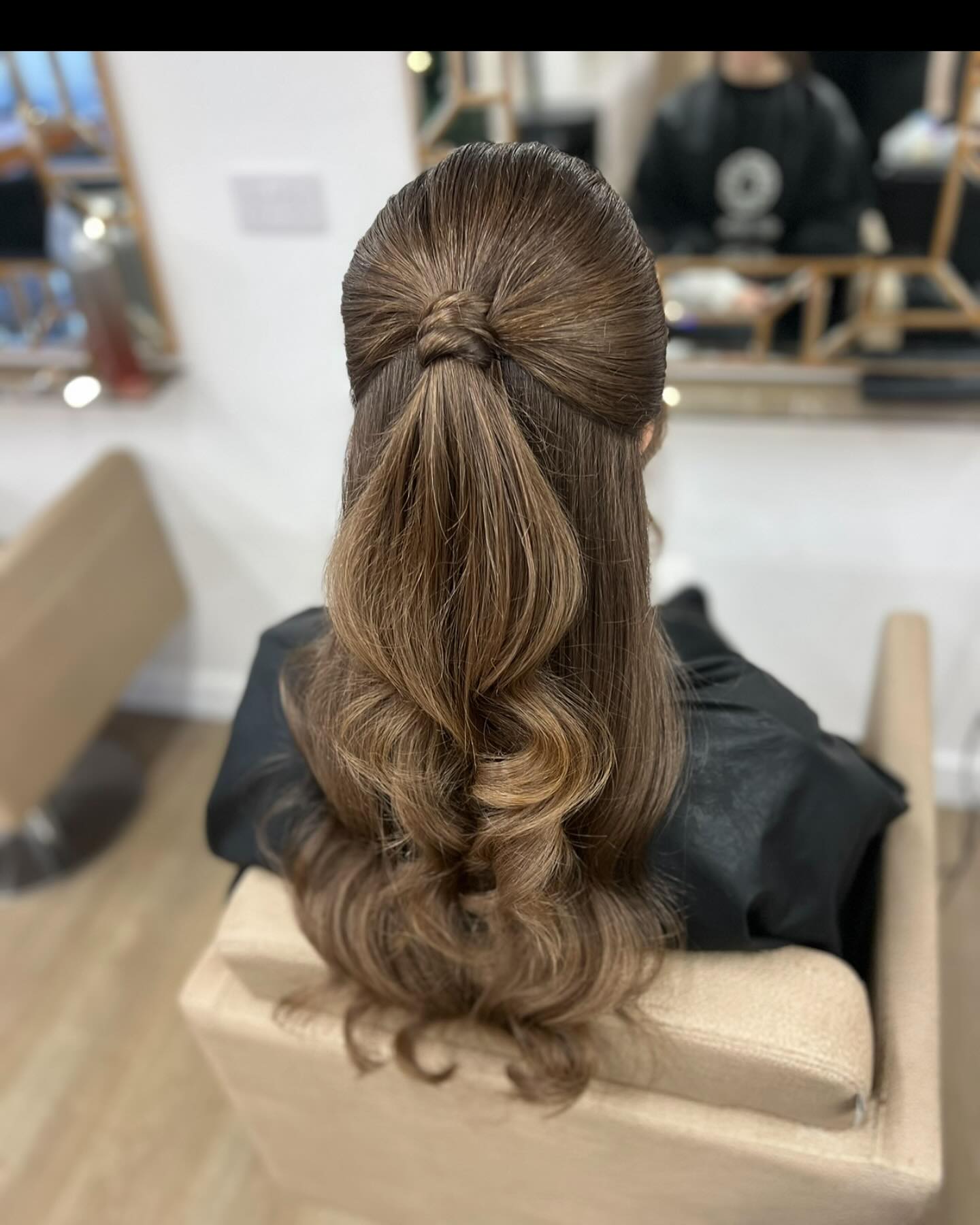 Chic Twisted Half-Up Style with Soft Waves