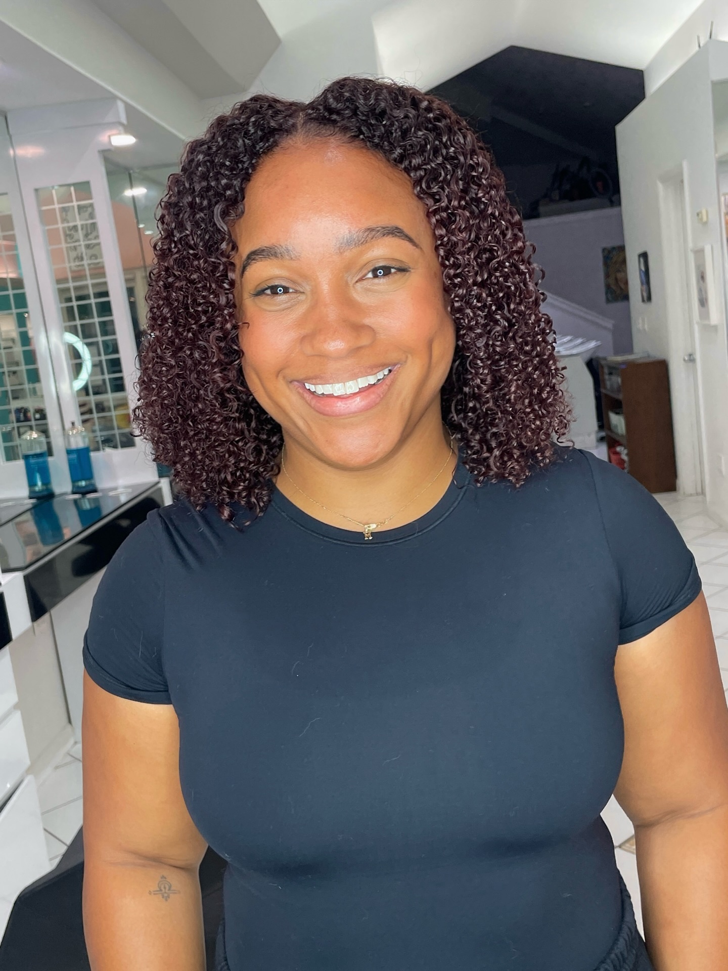 Defined Curly Bob with Subtle Highlights