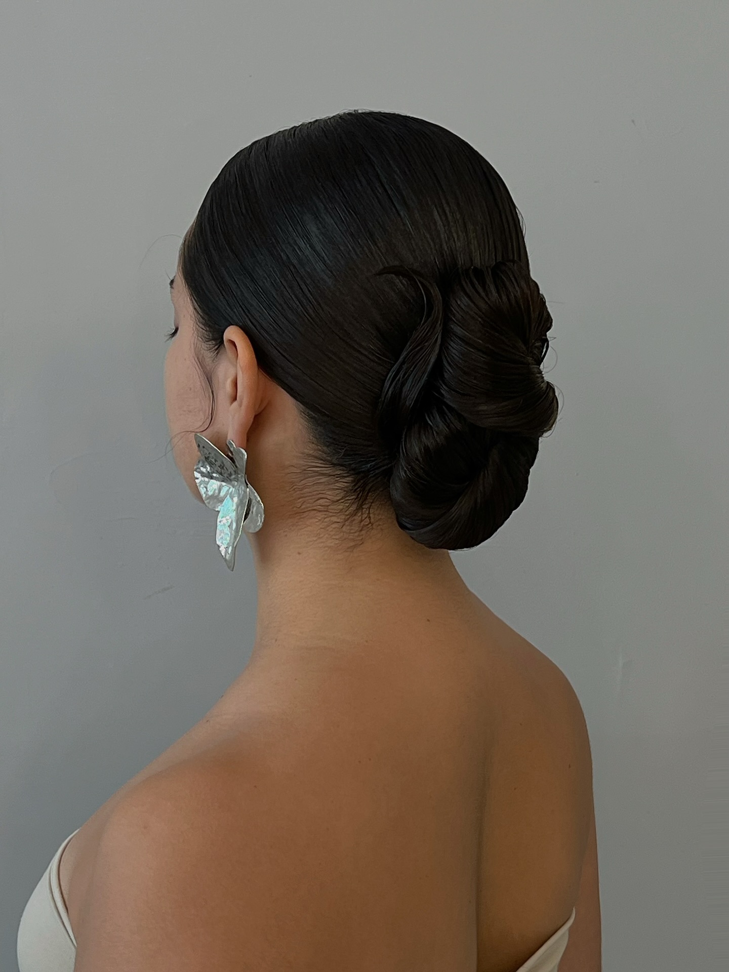 Elegant Sleek Low Bun with Twisted Detail