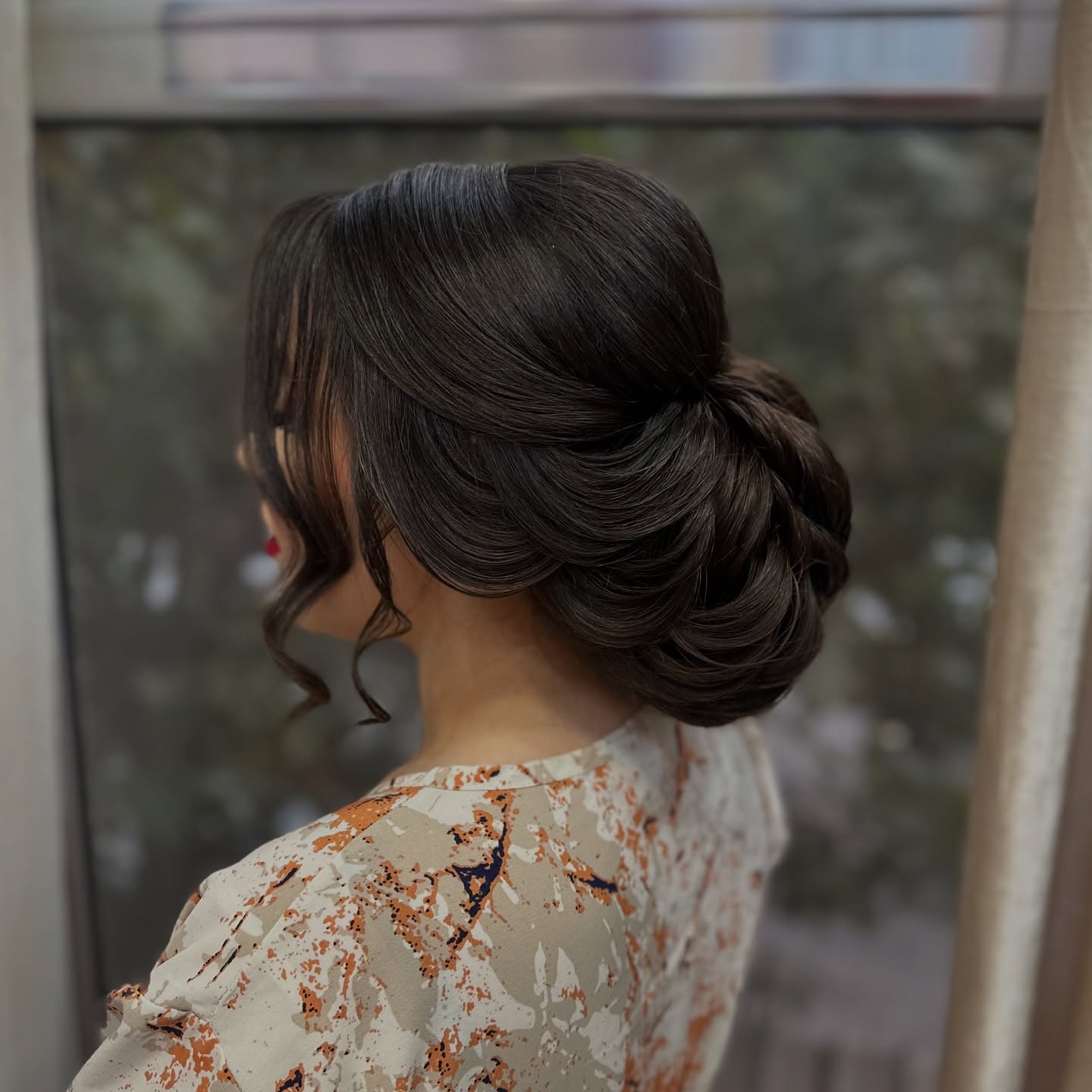 Elegant Textured Low Updo with Soft Curls