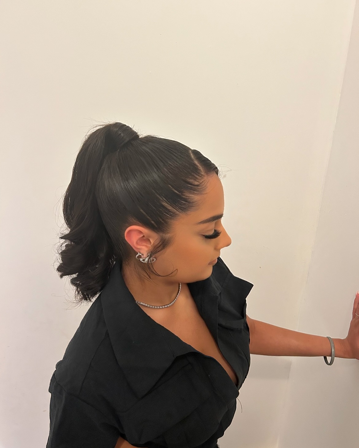 Sleek High Ponytail with Soft Waves