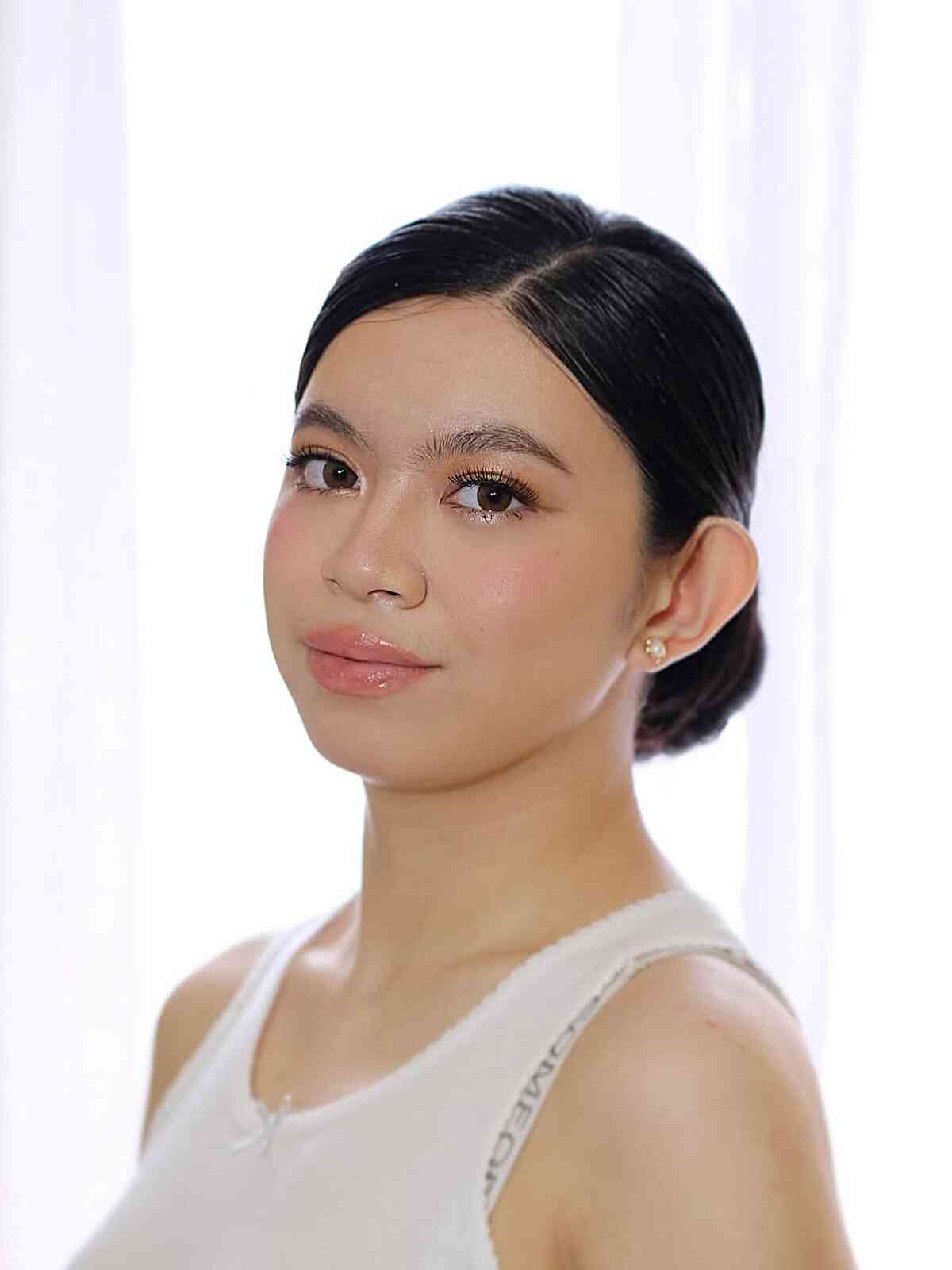 Sleek Low Bun with Center Part