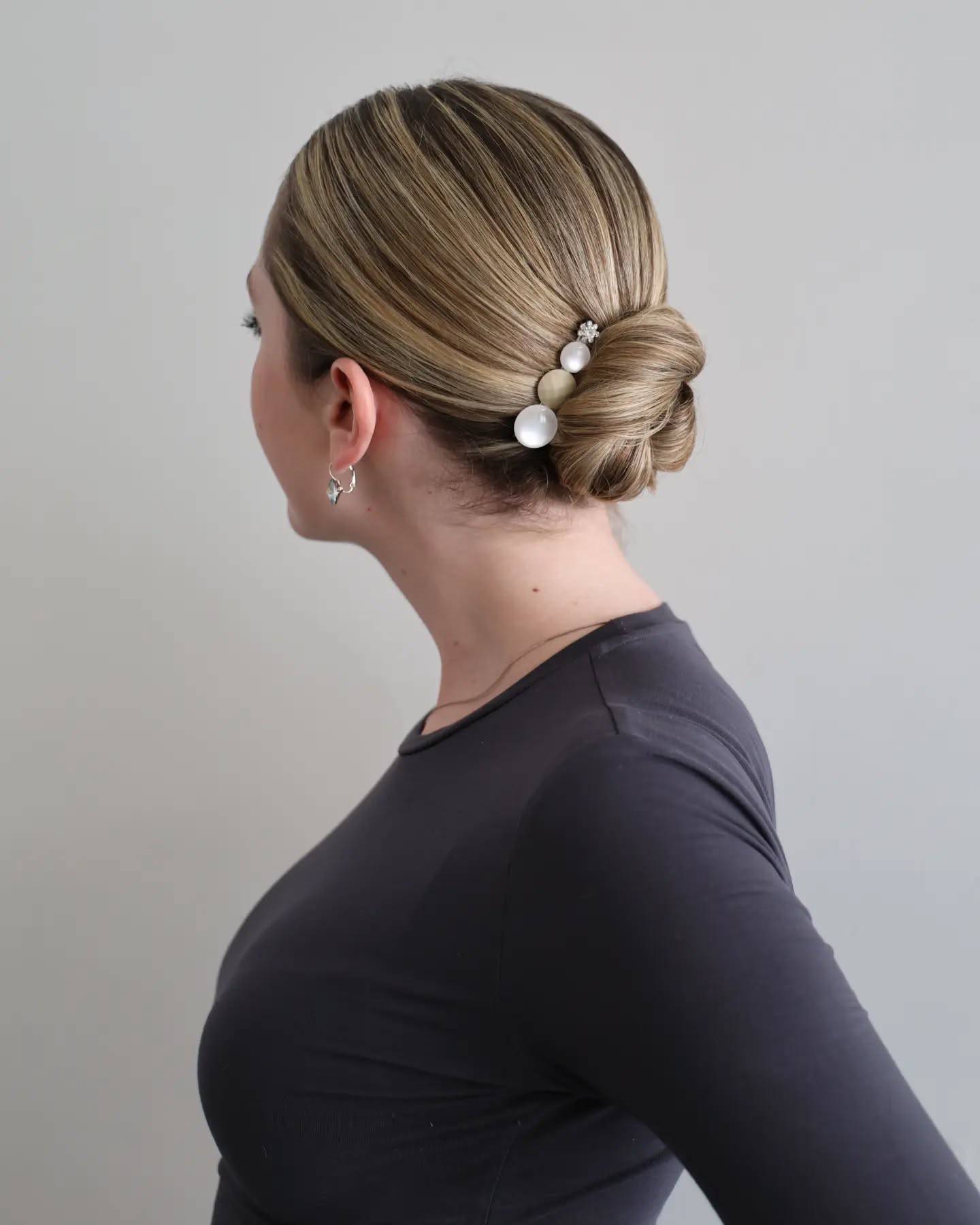 Sleek Low Bun with Decorative Hairpins