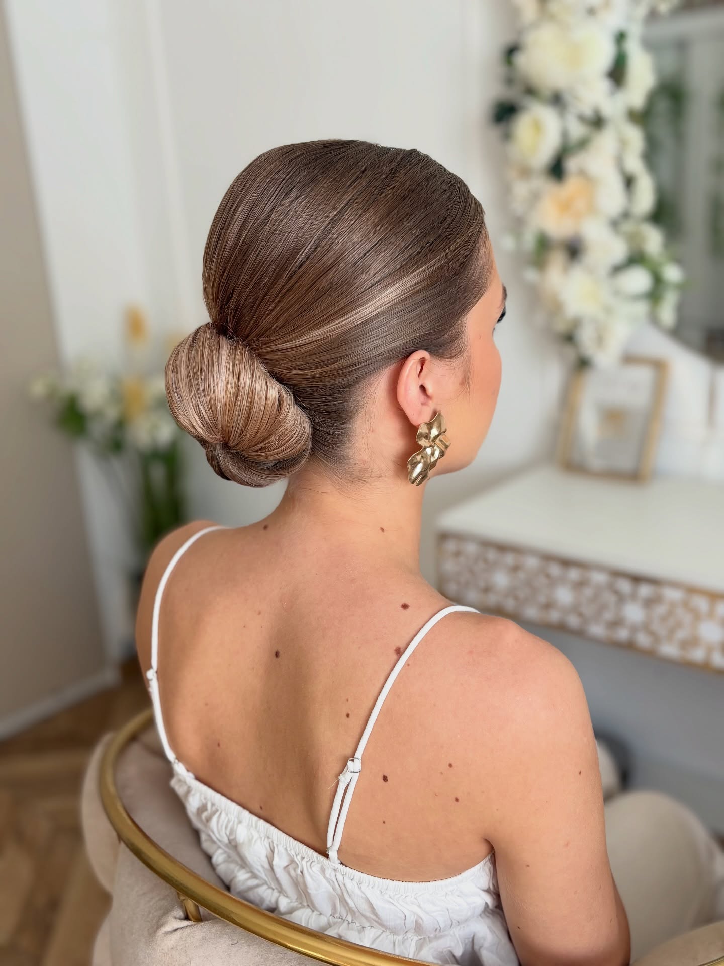 Sleek Low Chignon with Subtle Ombre