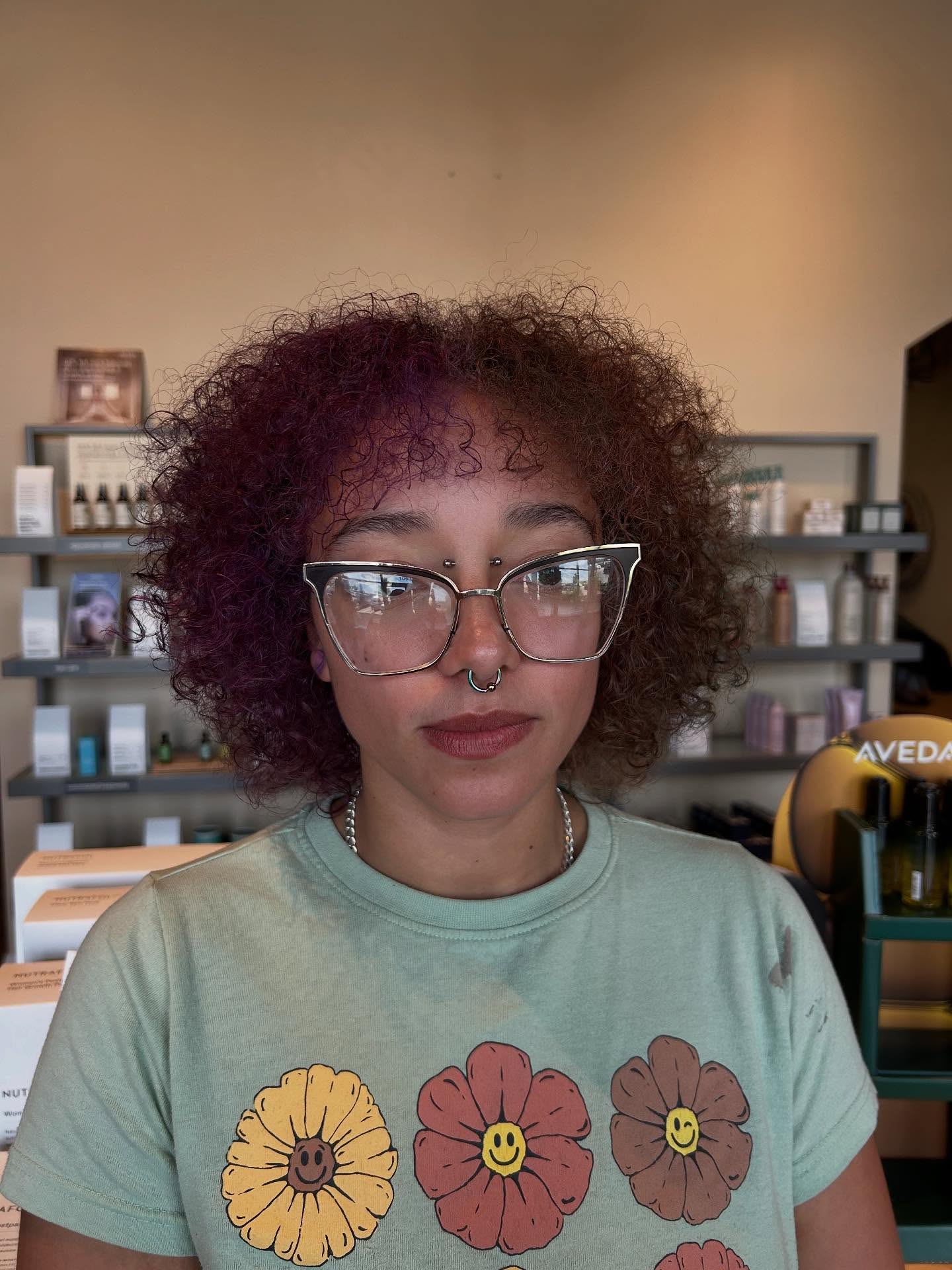 Vibrant Curly Bob with Bold Purple Highlights