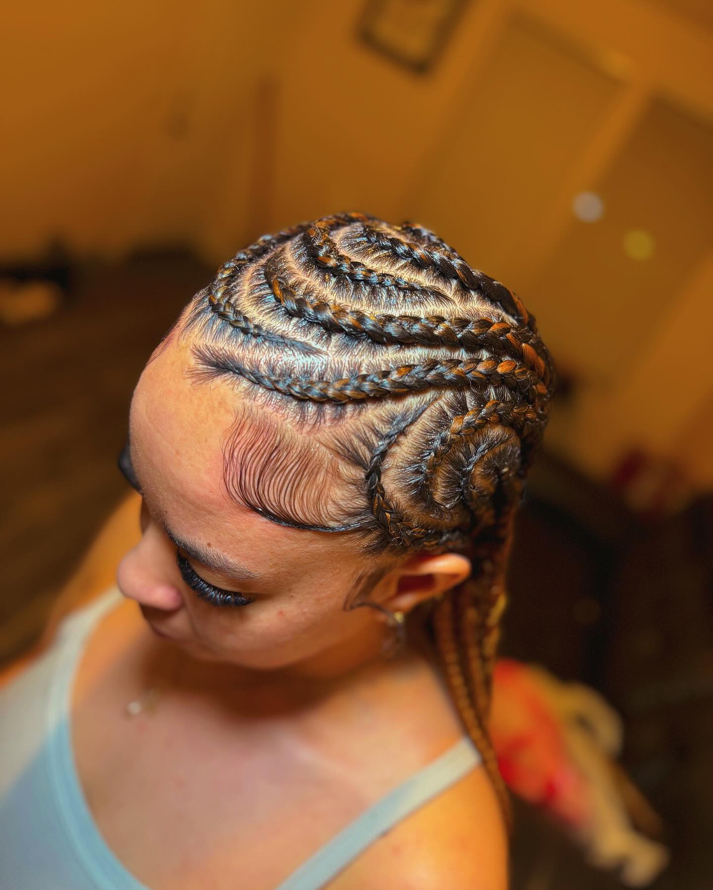 Artistic Spiral Cornrow Design with Defined Edges