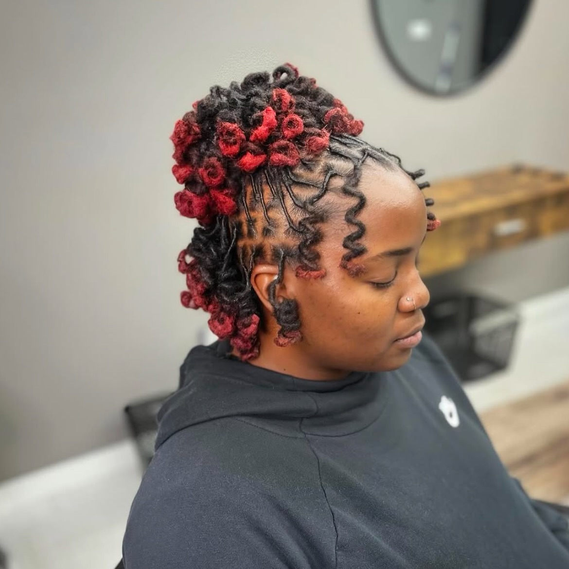 Bold Curly Dreadlock Updo with Vibrant Accents