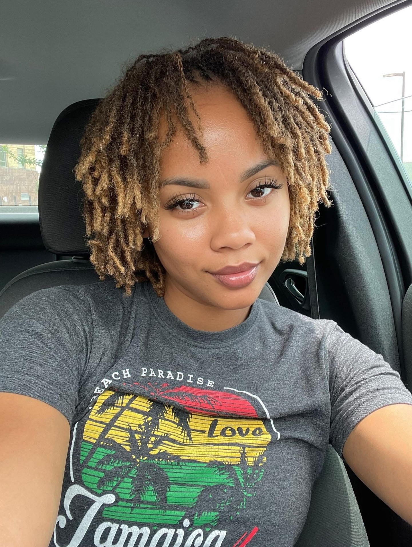 Chic Short Dreadlock Style with Subtle Highlights