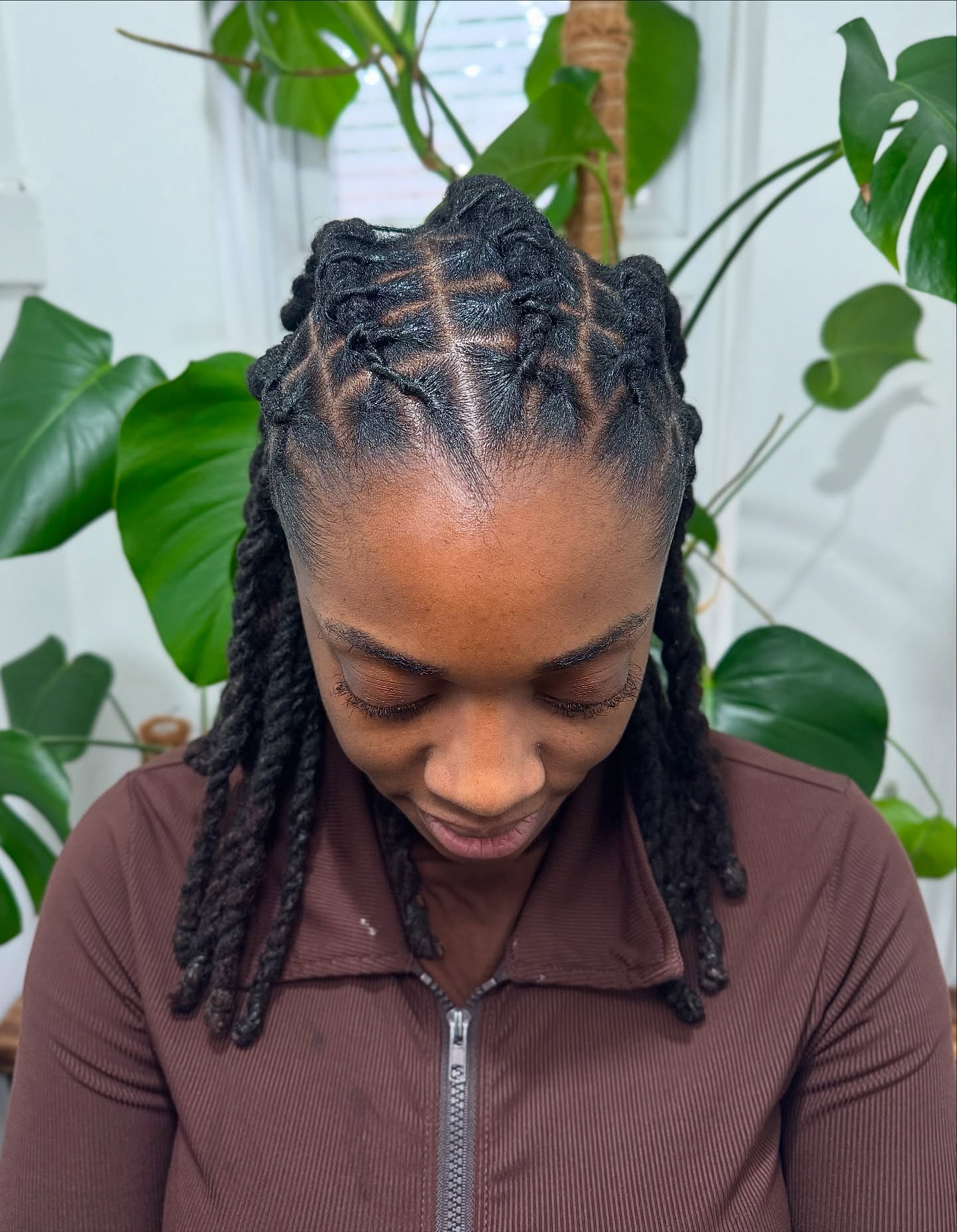 Intricate Braided Dreadlock Style with Defined Parting