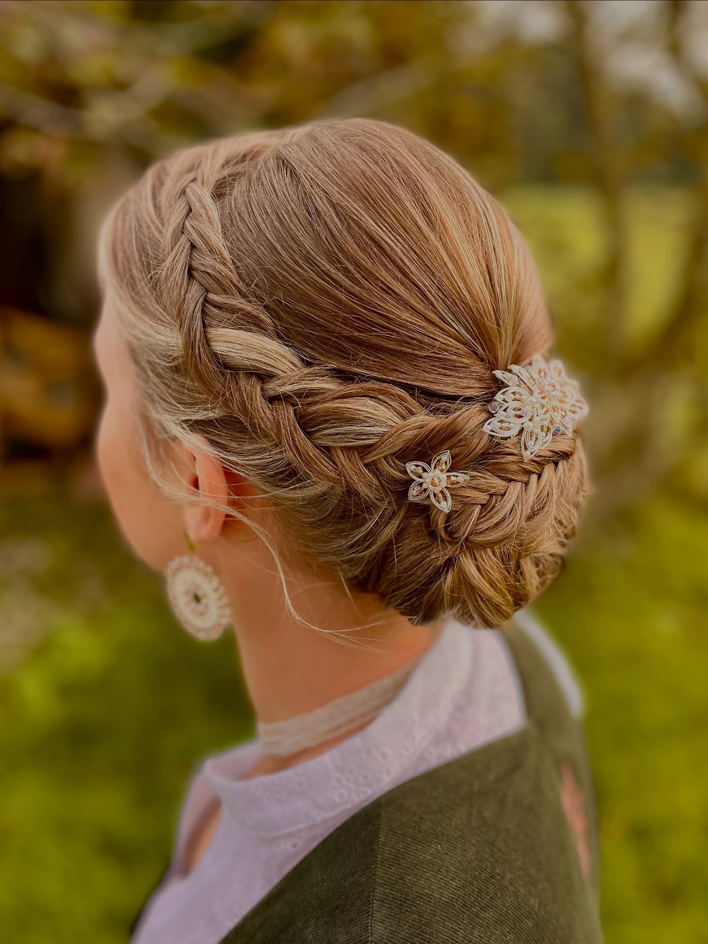Intricate Braided Updo with Floral Accents
