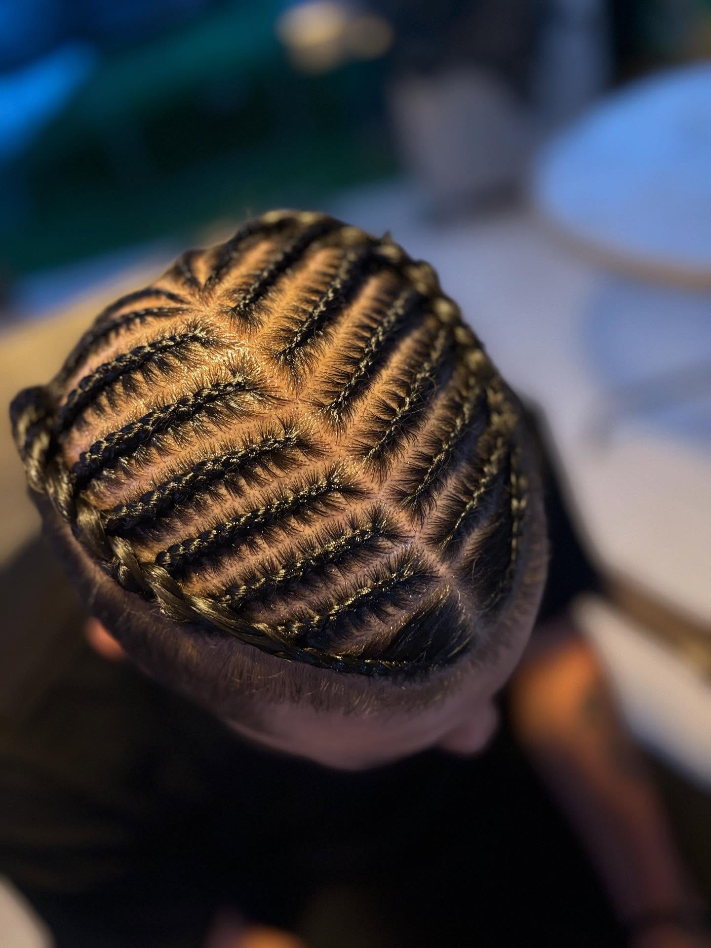 Intricate Flat Twist Design with Defined Parting