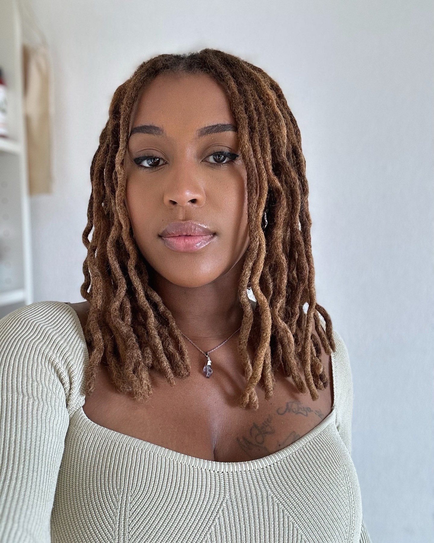 Textured Shoulder-Length Dreadlocks with Light Brown Tones