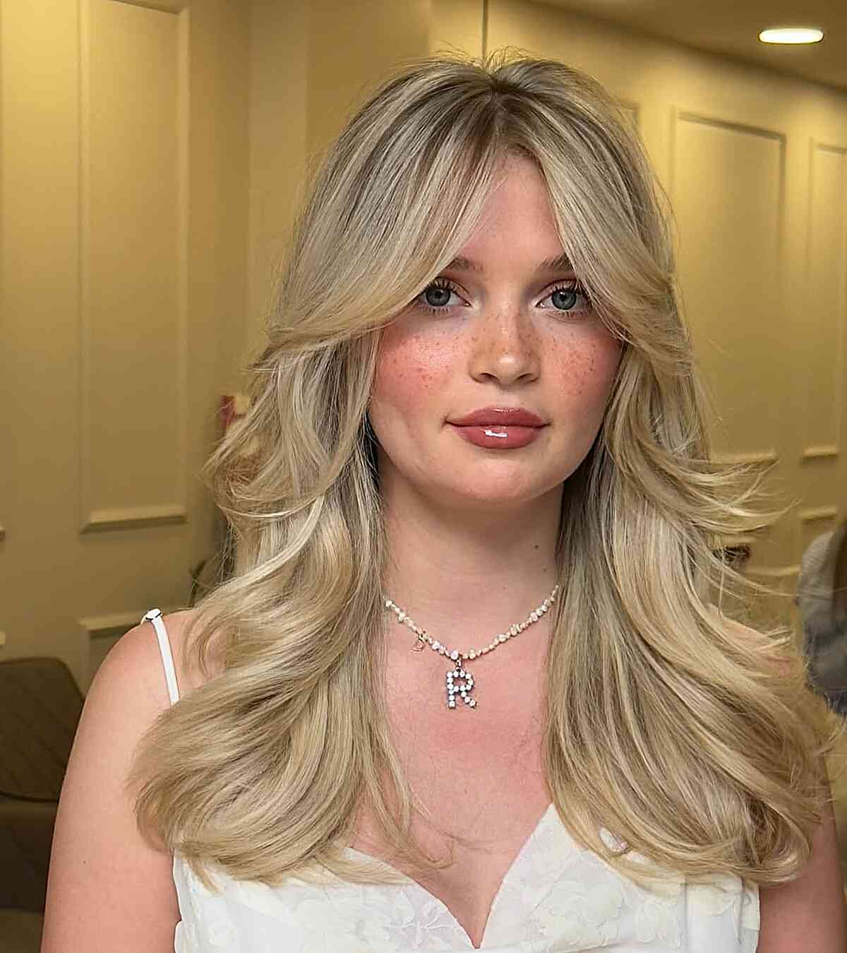 Elegant Face-Framing Curtain Bangs with Soft Waves