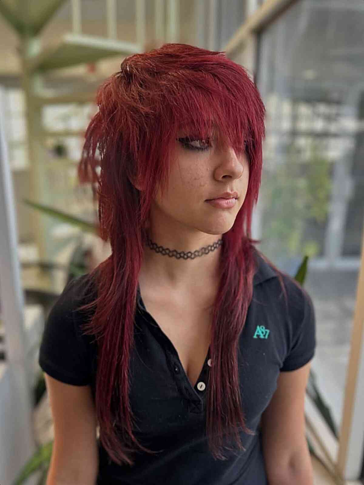 Dynamic Layered Emo Hairstyle with Bold Red Color