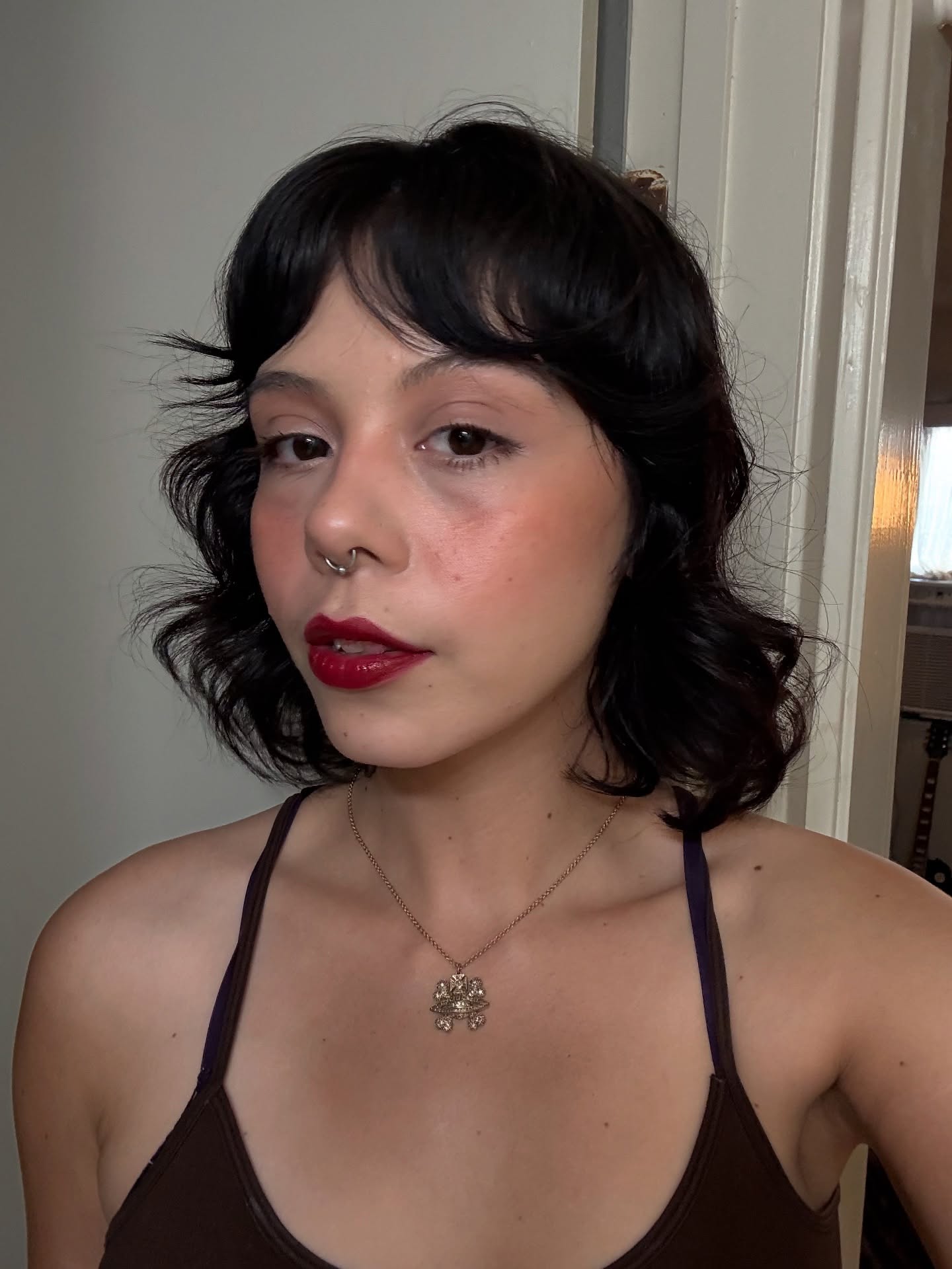 Playful Short Curly Cut with Soft Bangs