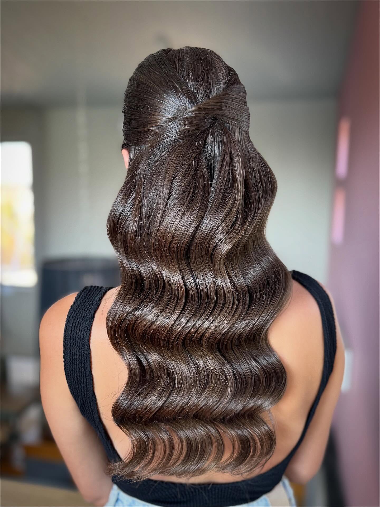 Glamorous Wavy Half-Up Hairstyle with Defined Curls