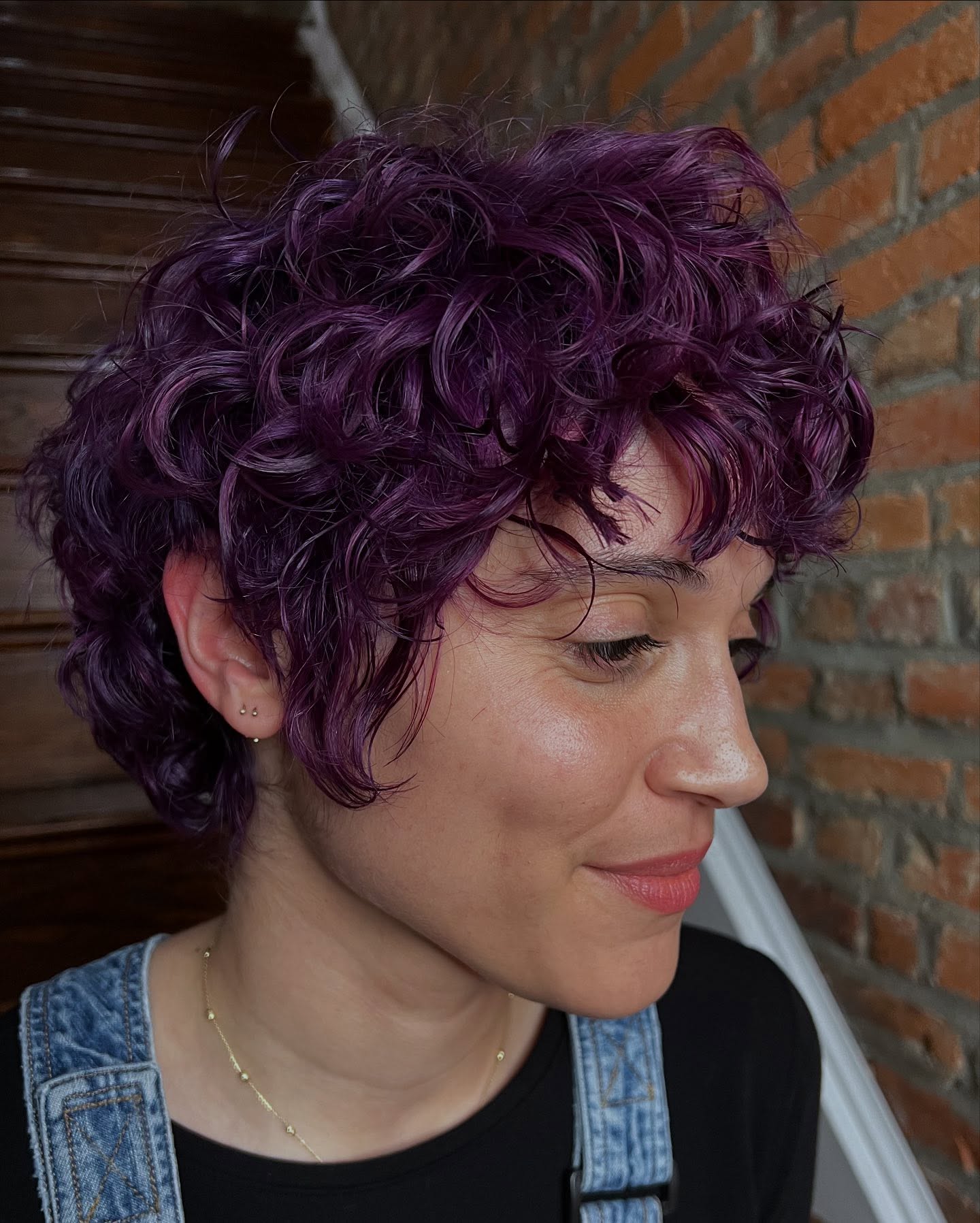 Charming Curly Pixie with Playful Purple Highlights