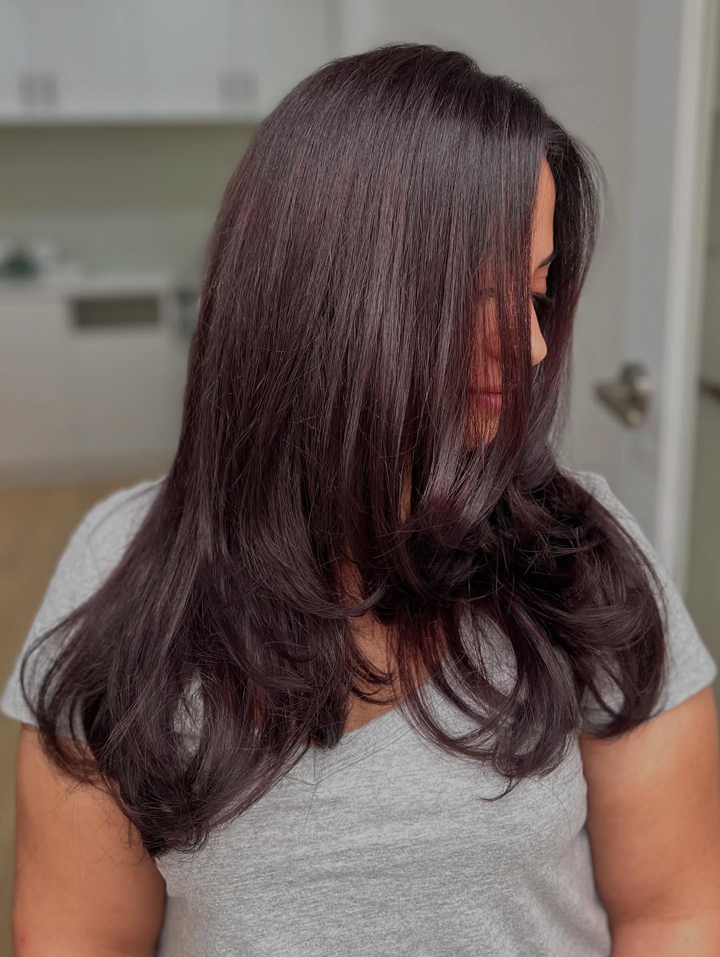 Rich Auburn Long Layered Cut with Soft Movement