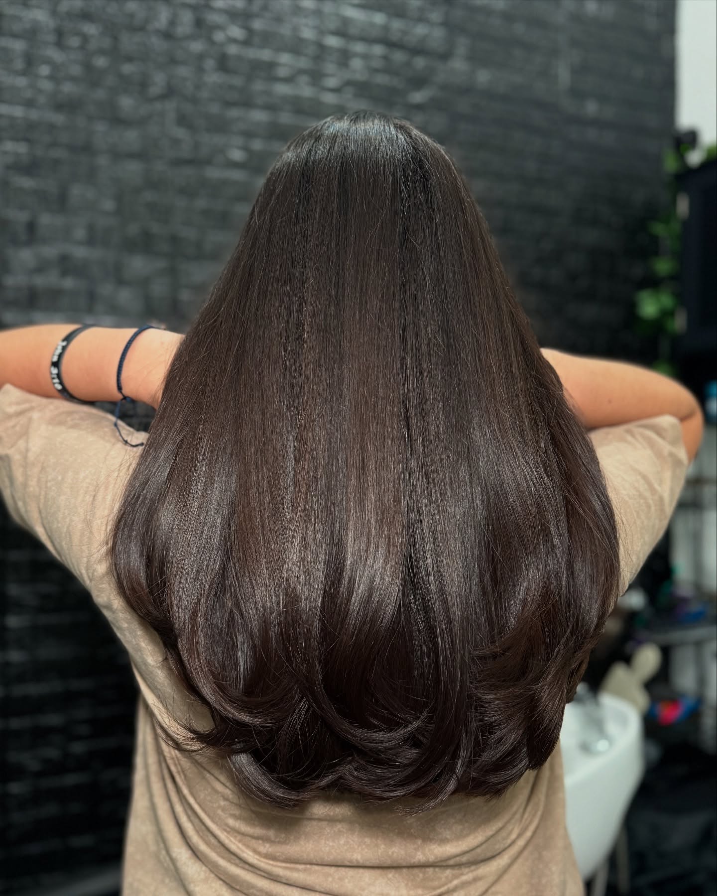 Sleek Long Layered Cut with Subtle Volume