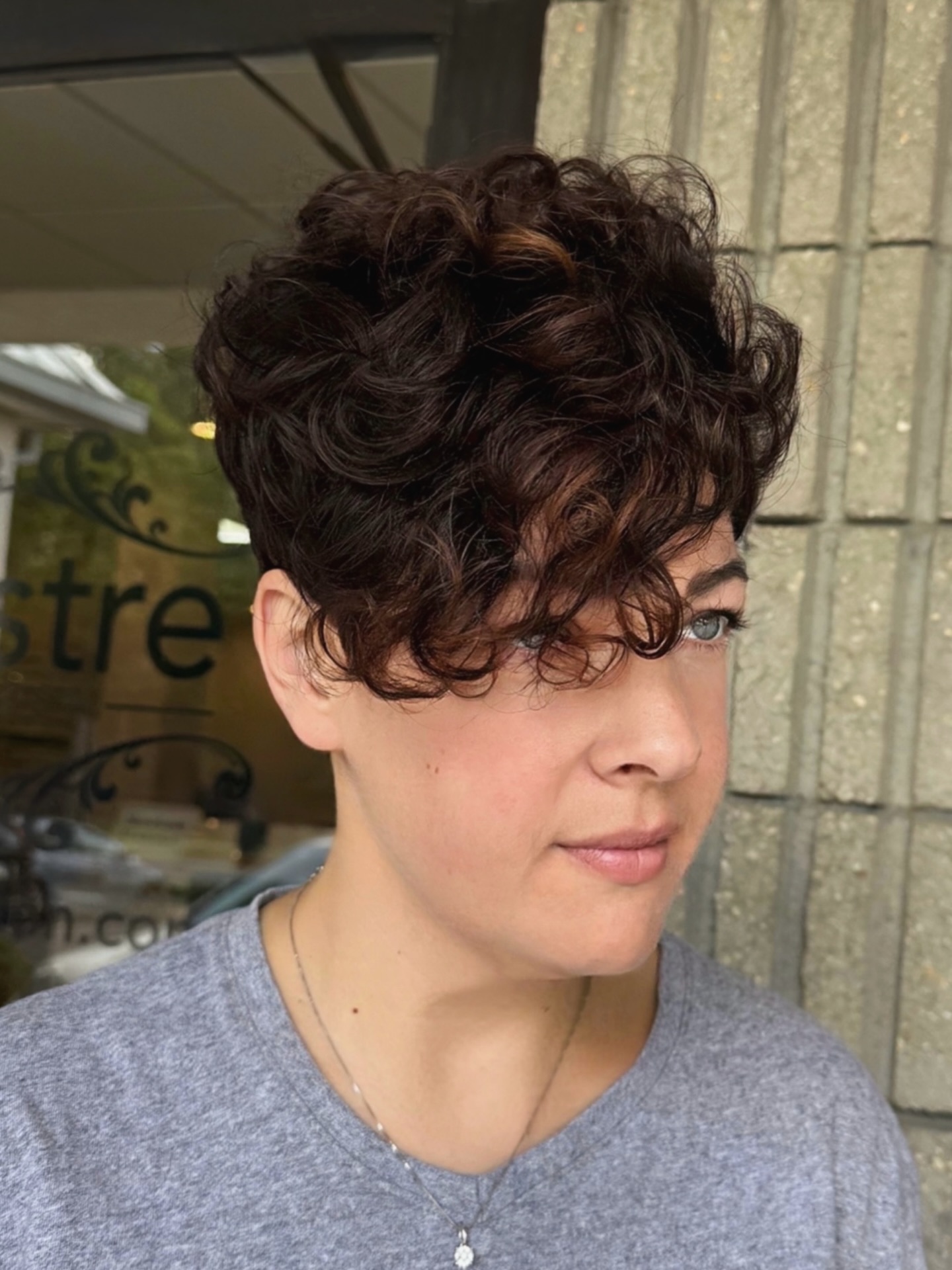 Textured Curly Pixie with Side-Swept Bangs
