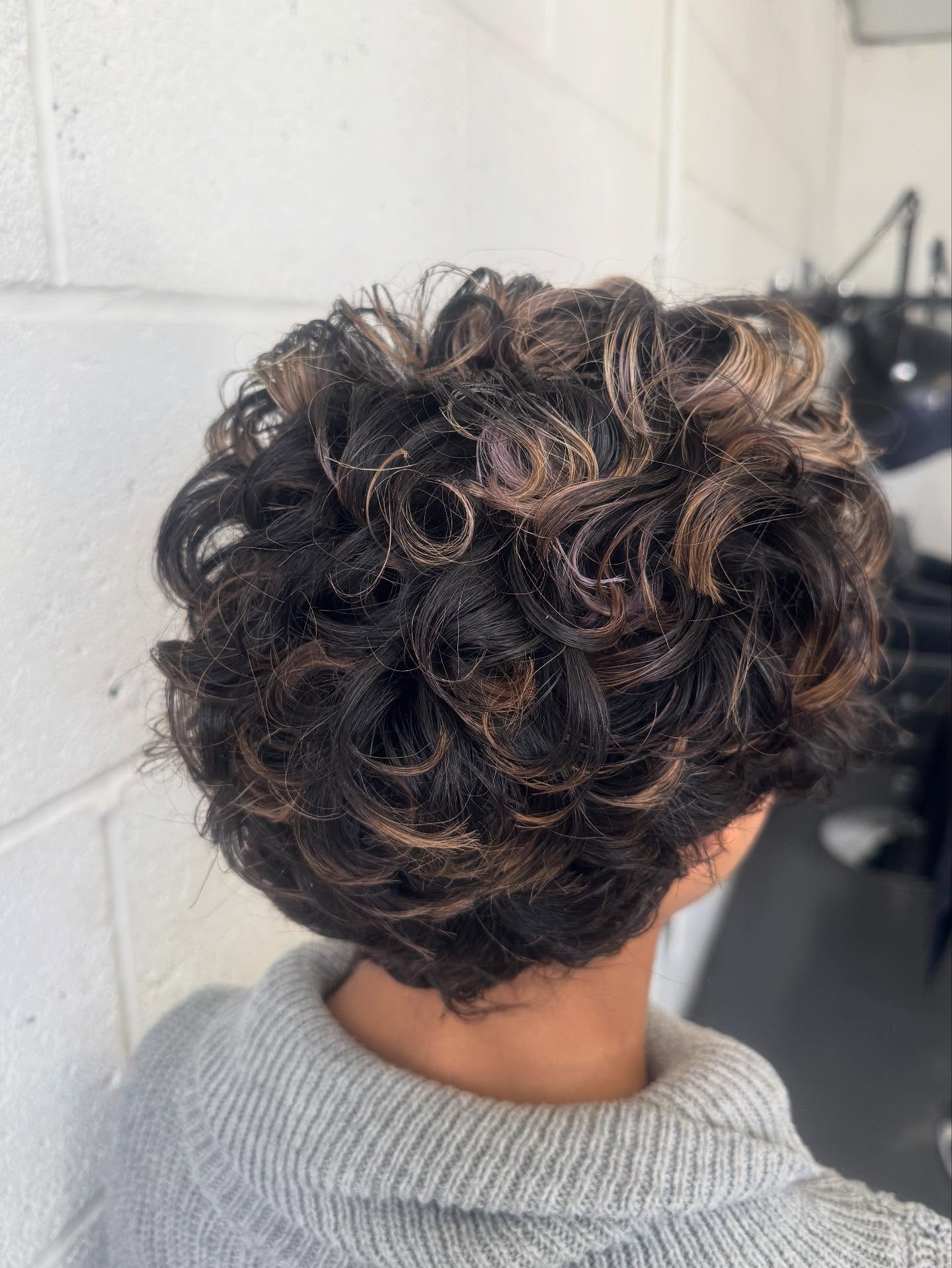 Textured Curly Pixie with Subtle Highlights