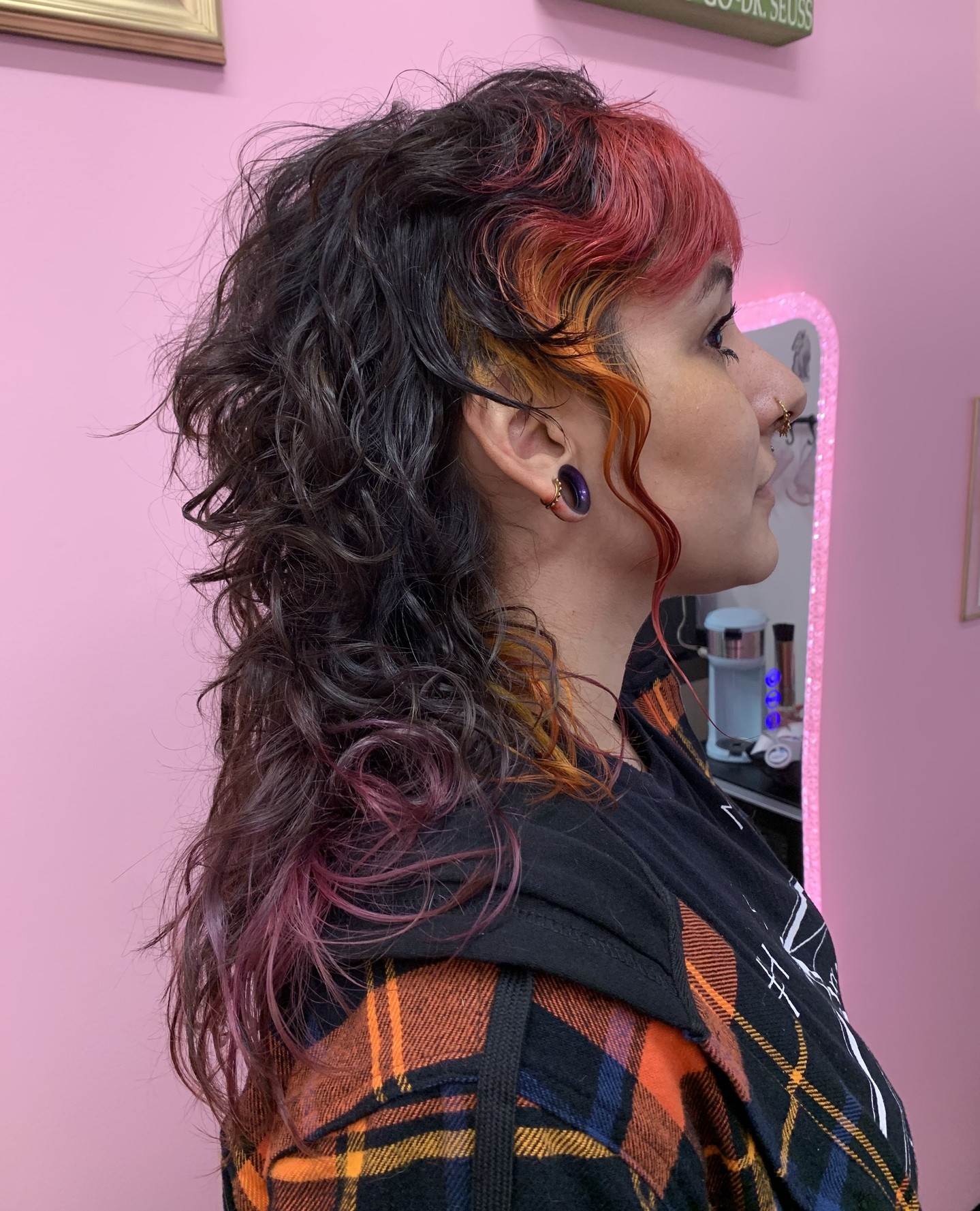 Vibrant Curly Mullet with Bold Color Accents