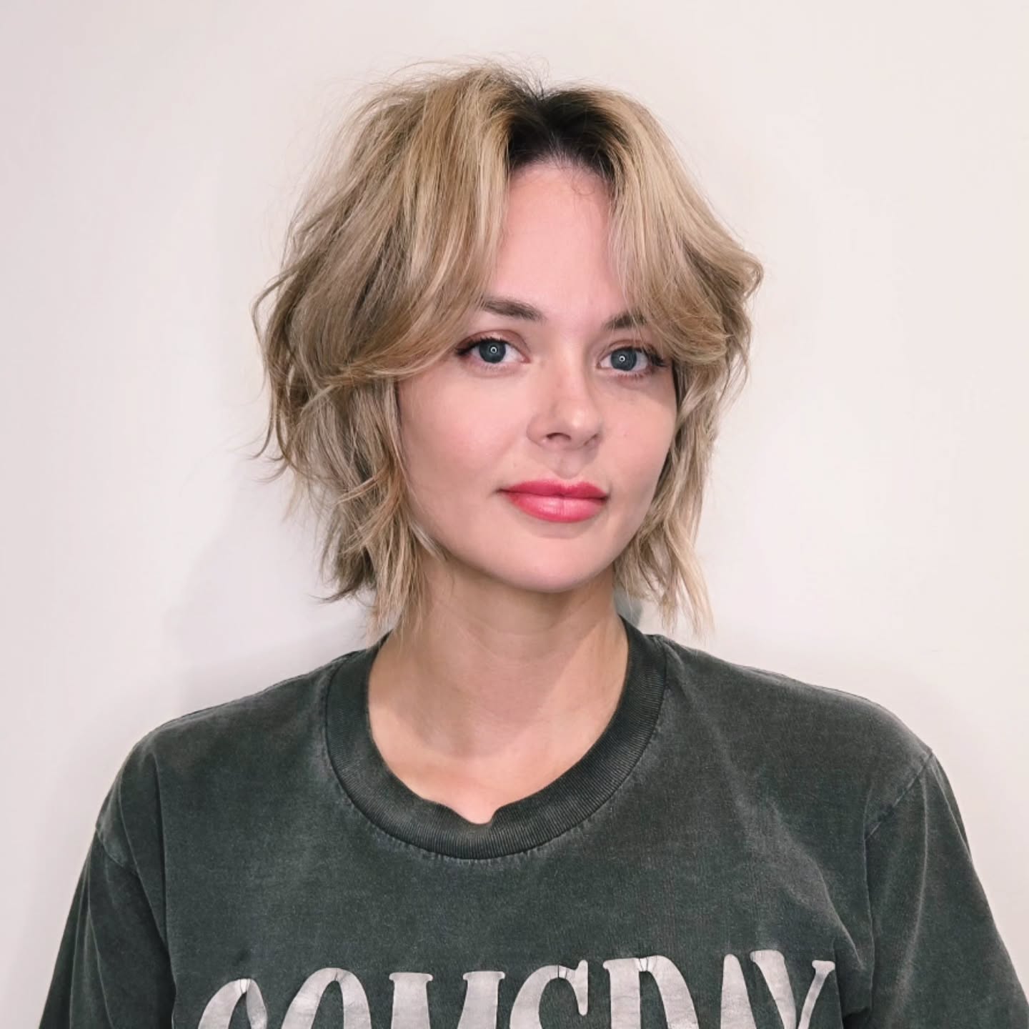 Effortless Blonde Tousled Bob with Wispy Bangs