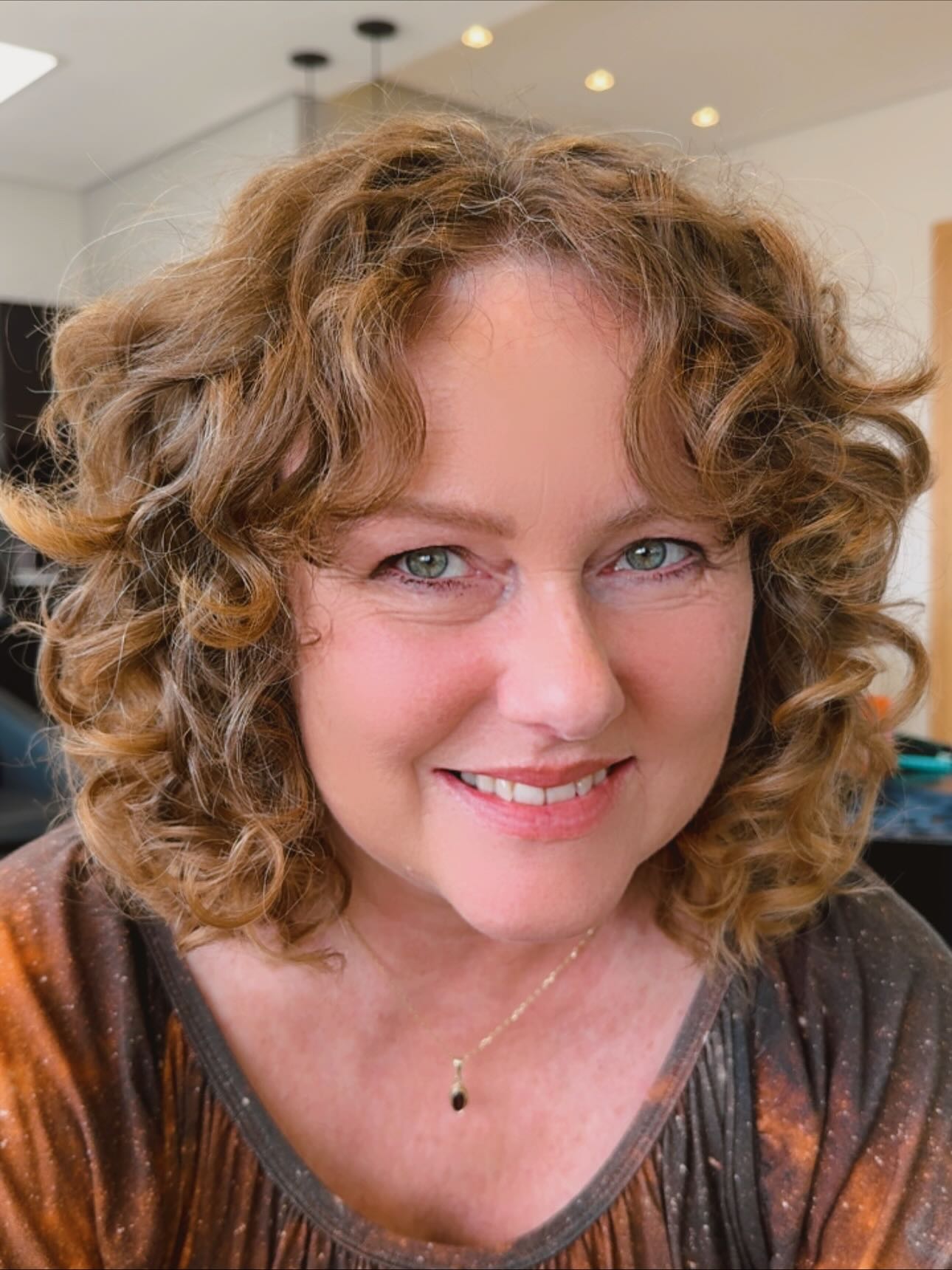 Golden Chestnut Curly Bob with Soft Bangs