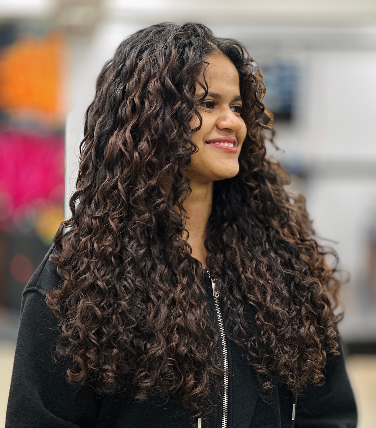 Luxurious Long Chestnut Curls with Subtle Highlights