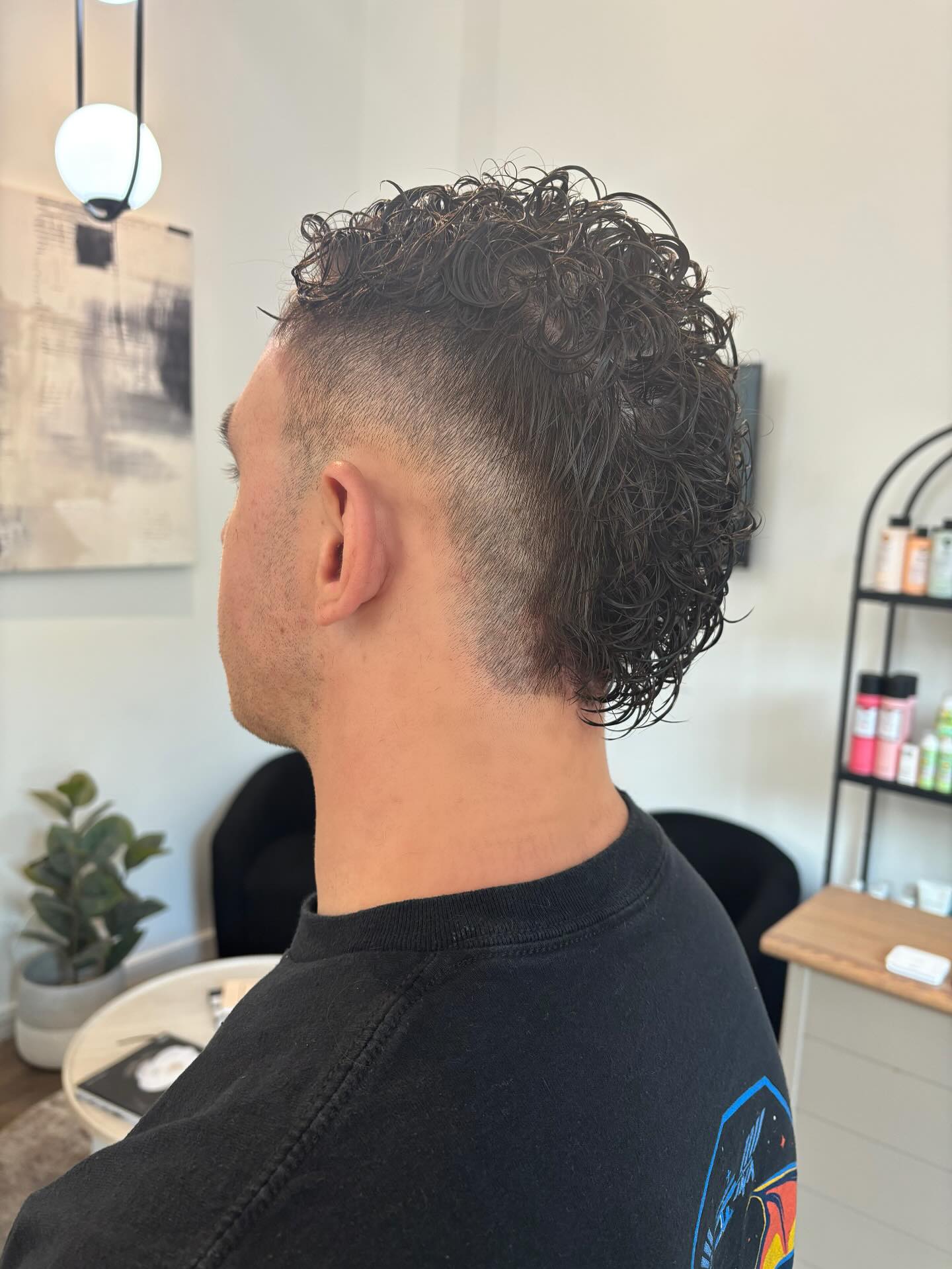 Modern Curly Tapered Cut with Defined Texture