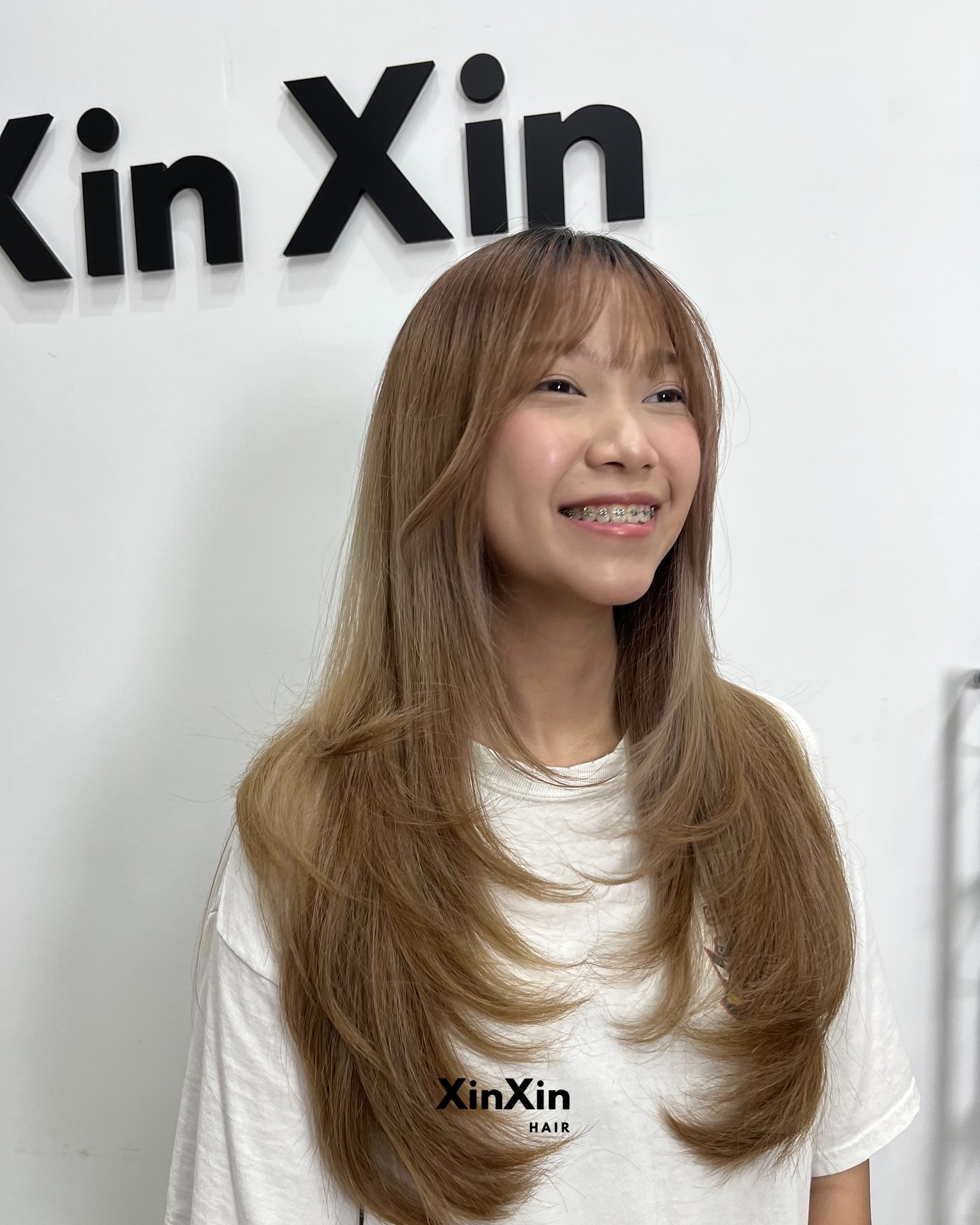 Modern Long Layers with Subtle Face-Framing Bangs