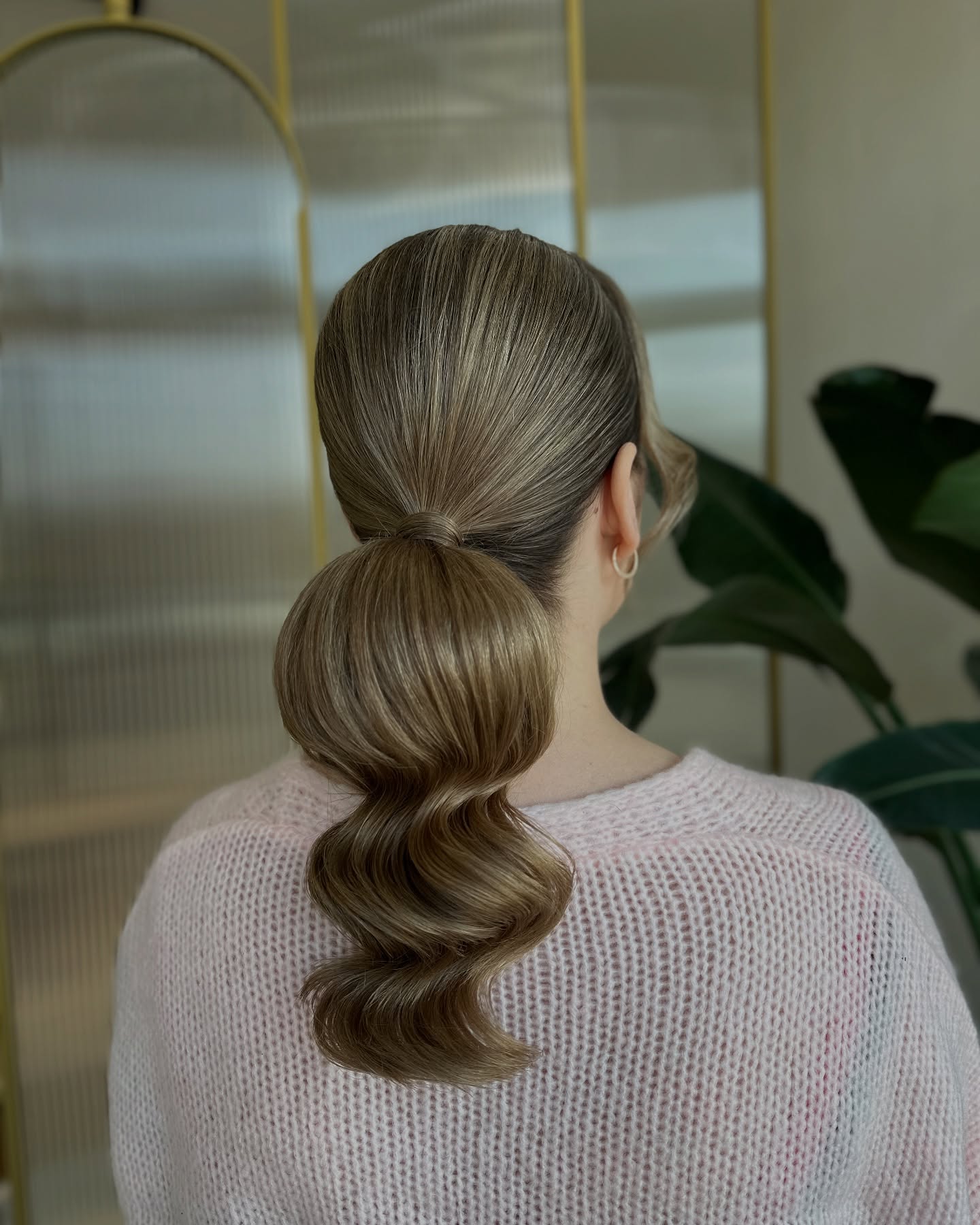Sleek Low Ponytail with Elegant Waves