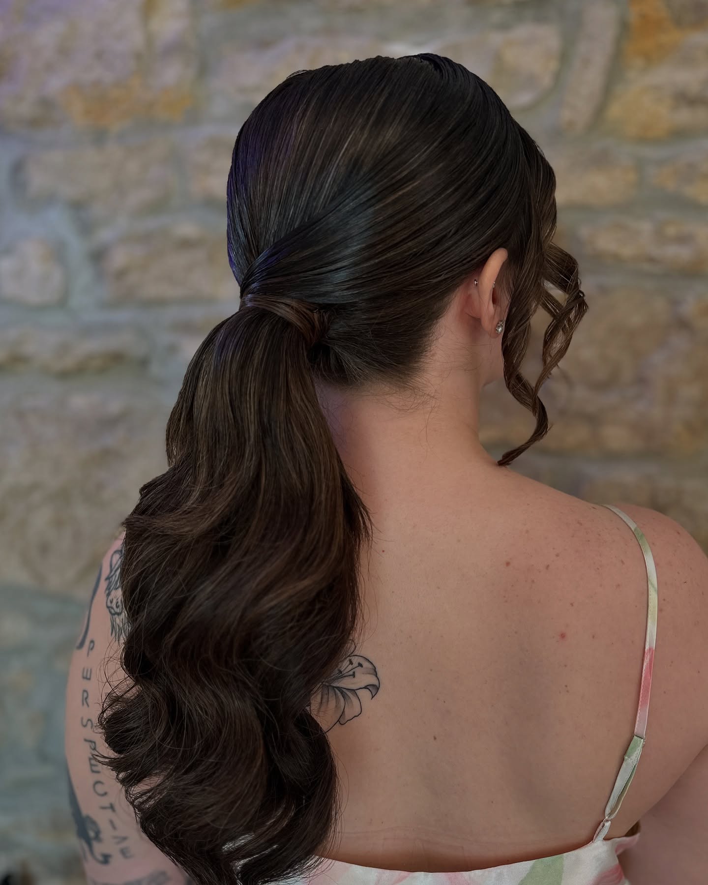 Sleek Textured Ponytail with Loose Waves