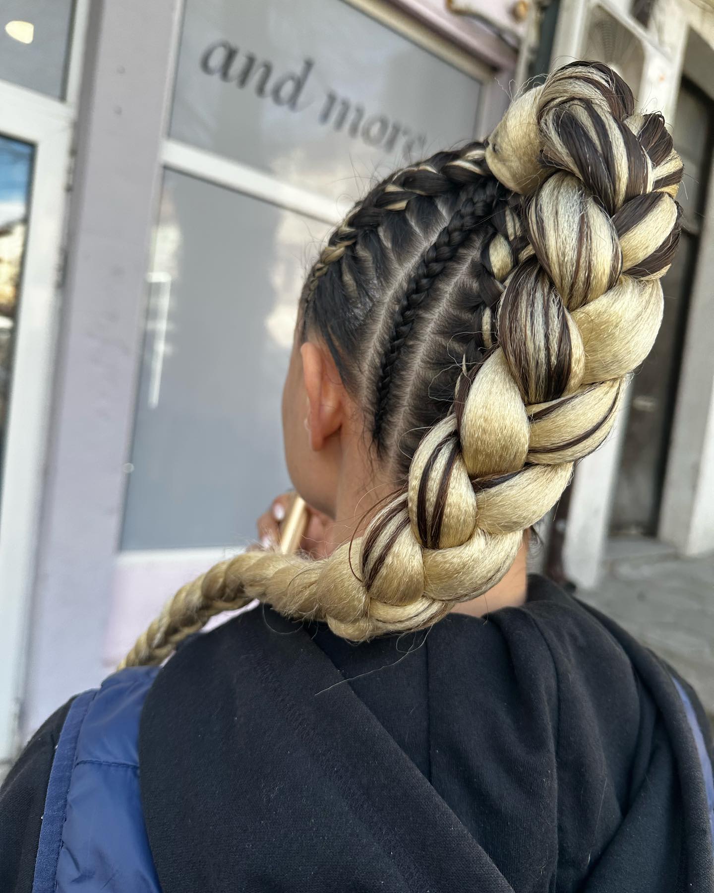 Bold High Braided Bun with Intricate Undercut