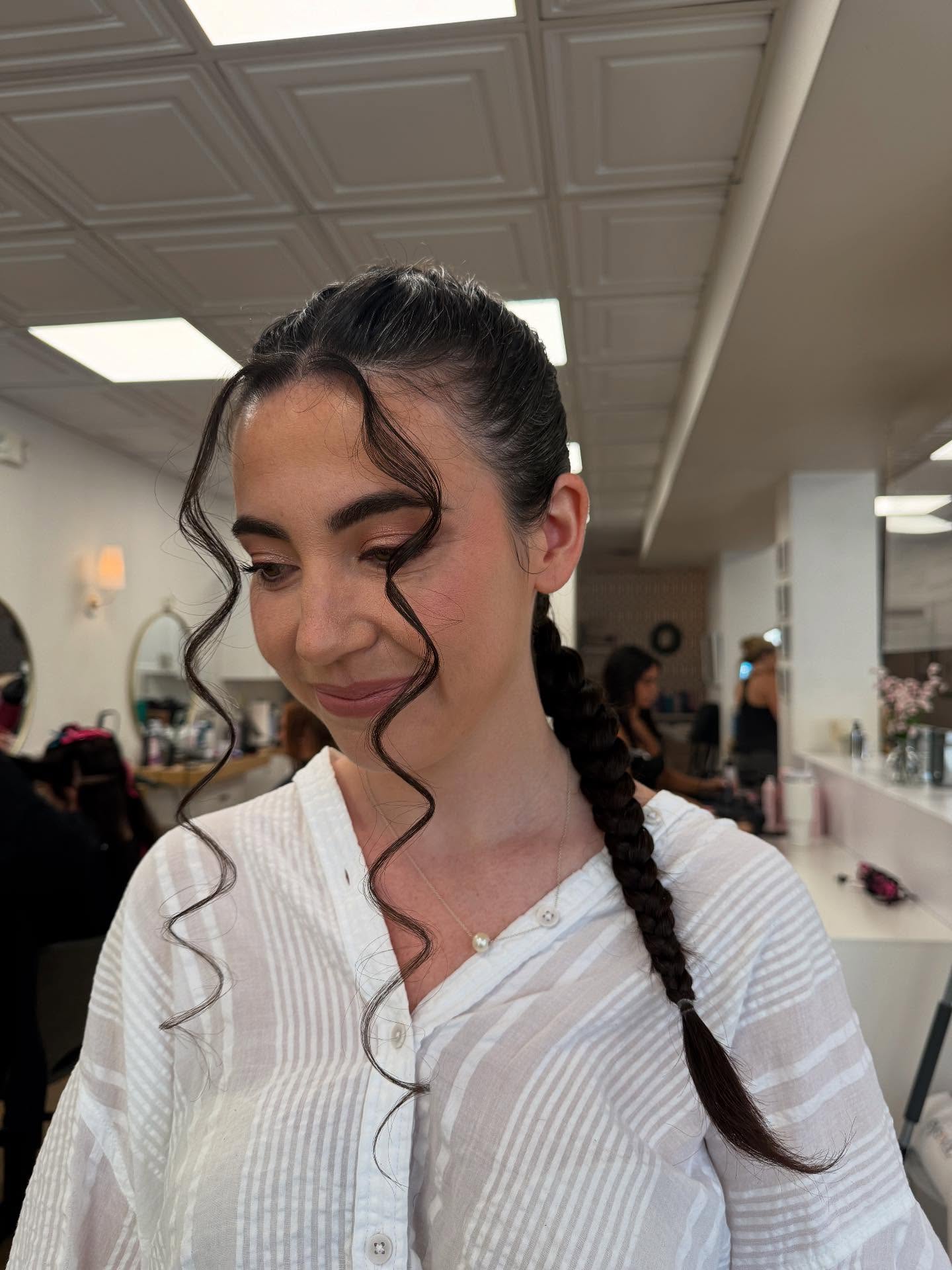 Chic Long Side Braid with Face-Framing Curls