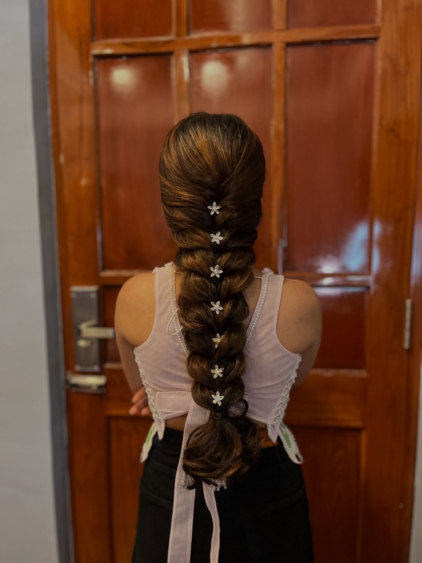 Elegant Long Braided Style with Floral Accents