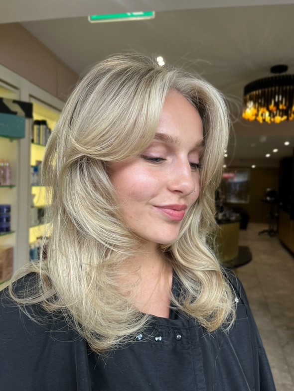 Softly Layered Fluffy Blonde Cut with Subtle Volume