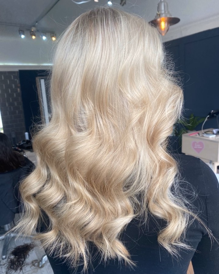 Voluminous Beachy Blonde Curls with Soft Layers